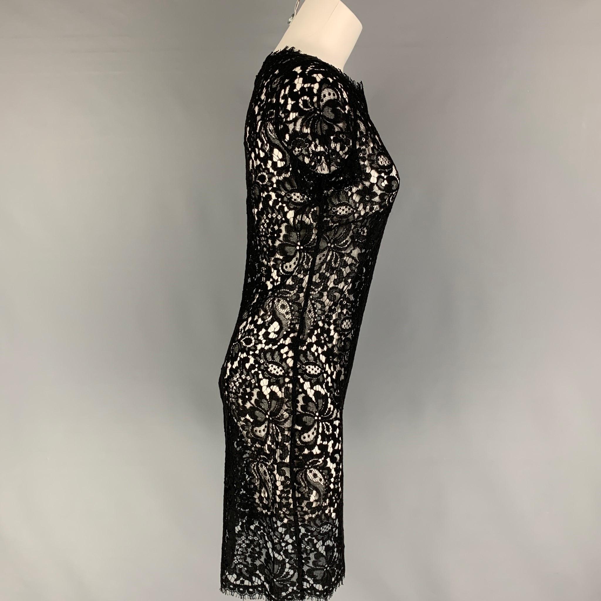 RALPH LAUREN 'Black Label' dress comes in a black lace cotton blend featuring short sleeves and a back zip up closure. 

Very Good Pre-Owned Condition.
Marked: 10

Measurements:

Shoulder: 15 in.
Bust: 34 in.
Waist: 32 in.
Hip: 36 in.
Sleeve: 8