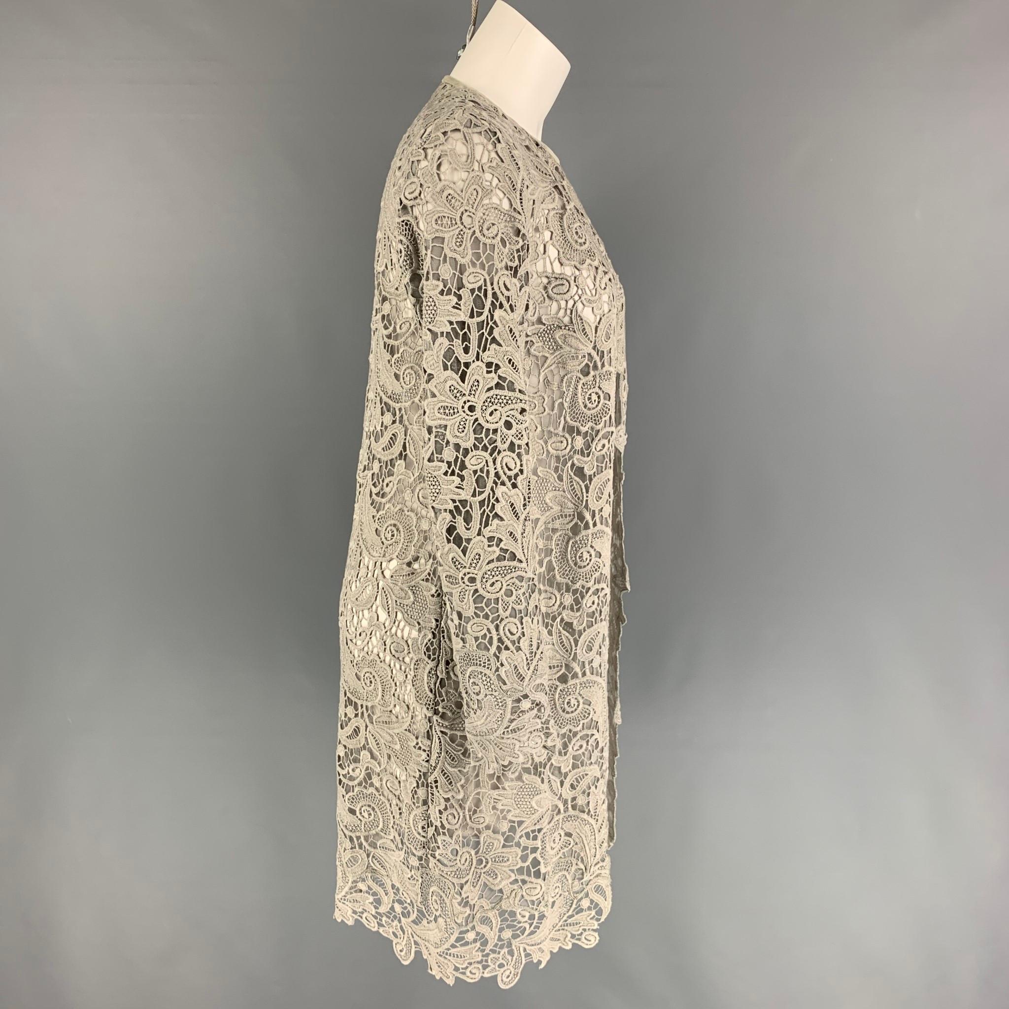 RALPH LAUREN 'Black Label' coat comes in a taupe lace cotton featuring a leather trim, collarless, and a open front. 

Very Good Pre-Owned Condition.
Marked: 2

Measurements:

Shoulder: 15 in.
Bust: 32 in.
Sleeve: 24 in.
Length: 37 in. 