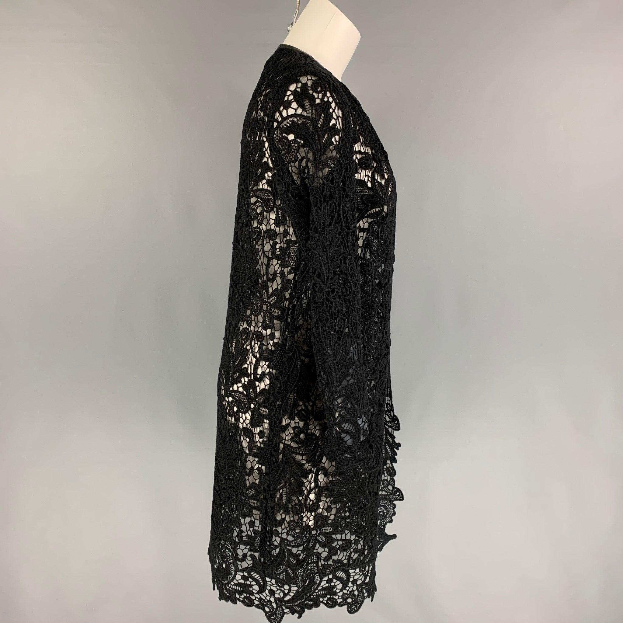 RALPH LAUREN 'Black Label' coat comes in a black lace cotton featuring a leather trim, collarless, and a open front.
Very Good
Pre-Owned Condition. 

Marked:   4 

Measurements: 
 
Shoulder: 15 inches  Bust: 34 inches  Sleeve: 24 inches  Length: