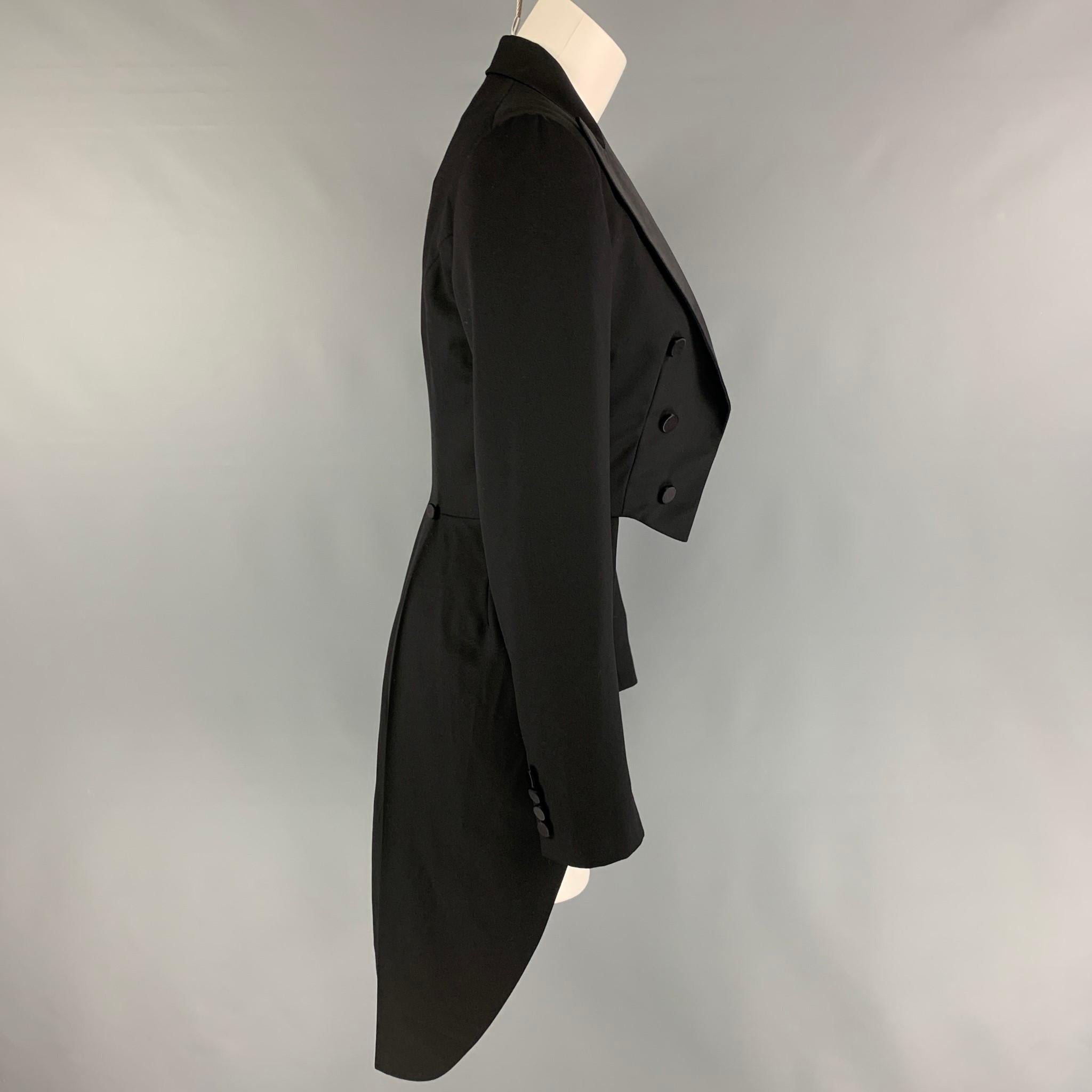 RALPH LAUREN 'Black Label' jacket comes in a black wool featuring a peak lapel, tails design, double breasted detail, and a open front. 

New With Tags. 
Marked: 4
Original Retail Price: $1,798.00

Measurements:

Shoulder: 16 in.
Bust: 32