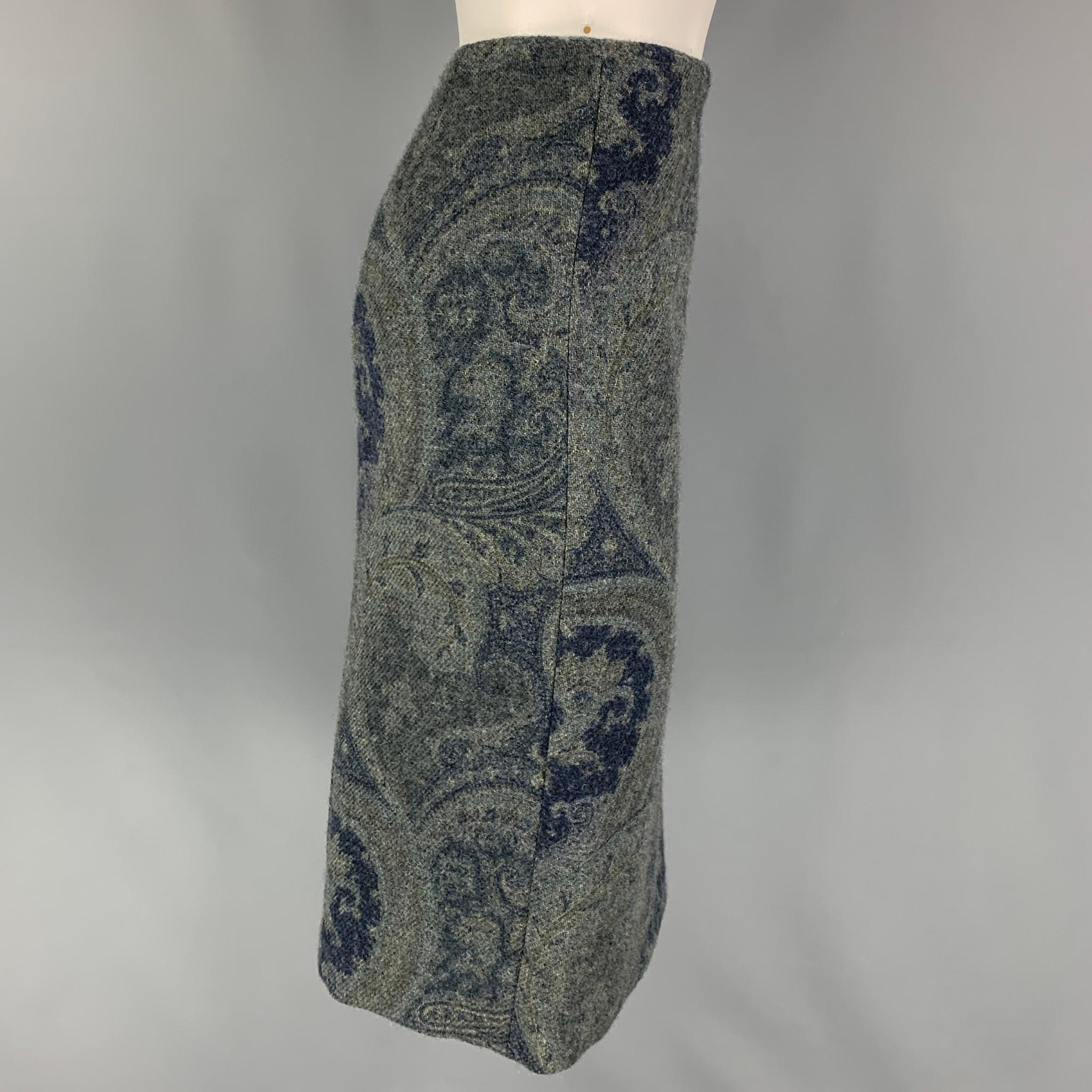 RALPH LAUREN 'Black Label' skirt comes in a grey & blue paisley wool with a slip liner featuring a pencil style, back slit, and aside zipper closure. Made in USA.

Very Good Pre-Owned Condition.
Marked: 4

Measurements:

Waist: 30 in.
Hip: 36