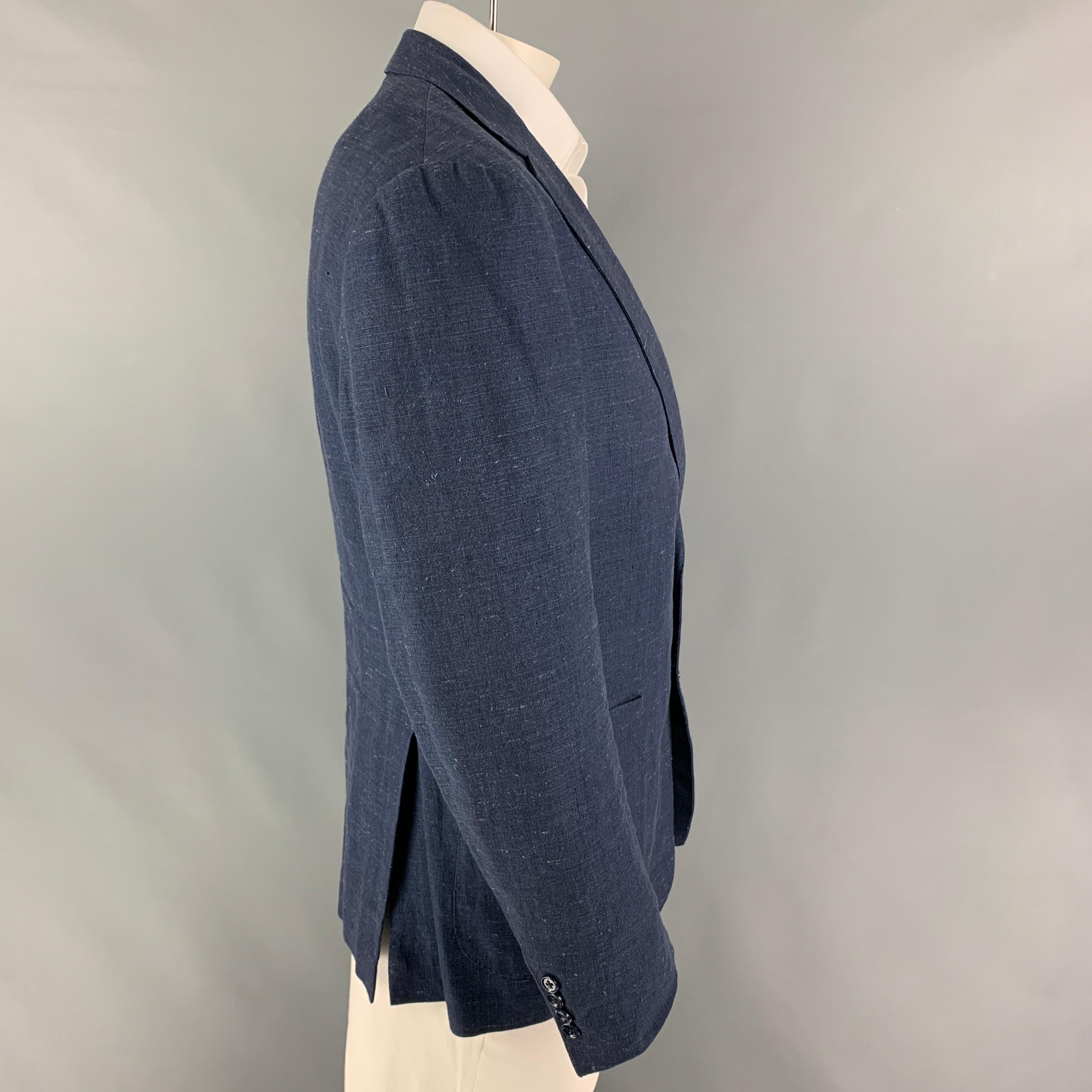 RALPH LAUREN 'Black Label' sport coat comes in a indigo textured linen / silk featuring a notch lapel, patch pockets, double back vent, and a double button closure. 

Very Good Pre-Owned Condition.
Marked: 44 R

Measurements:

Shoulder: 19
