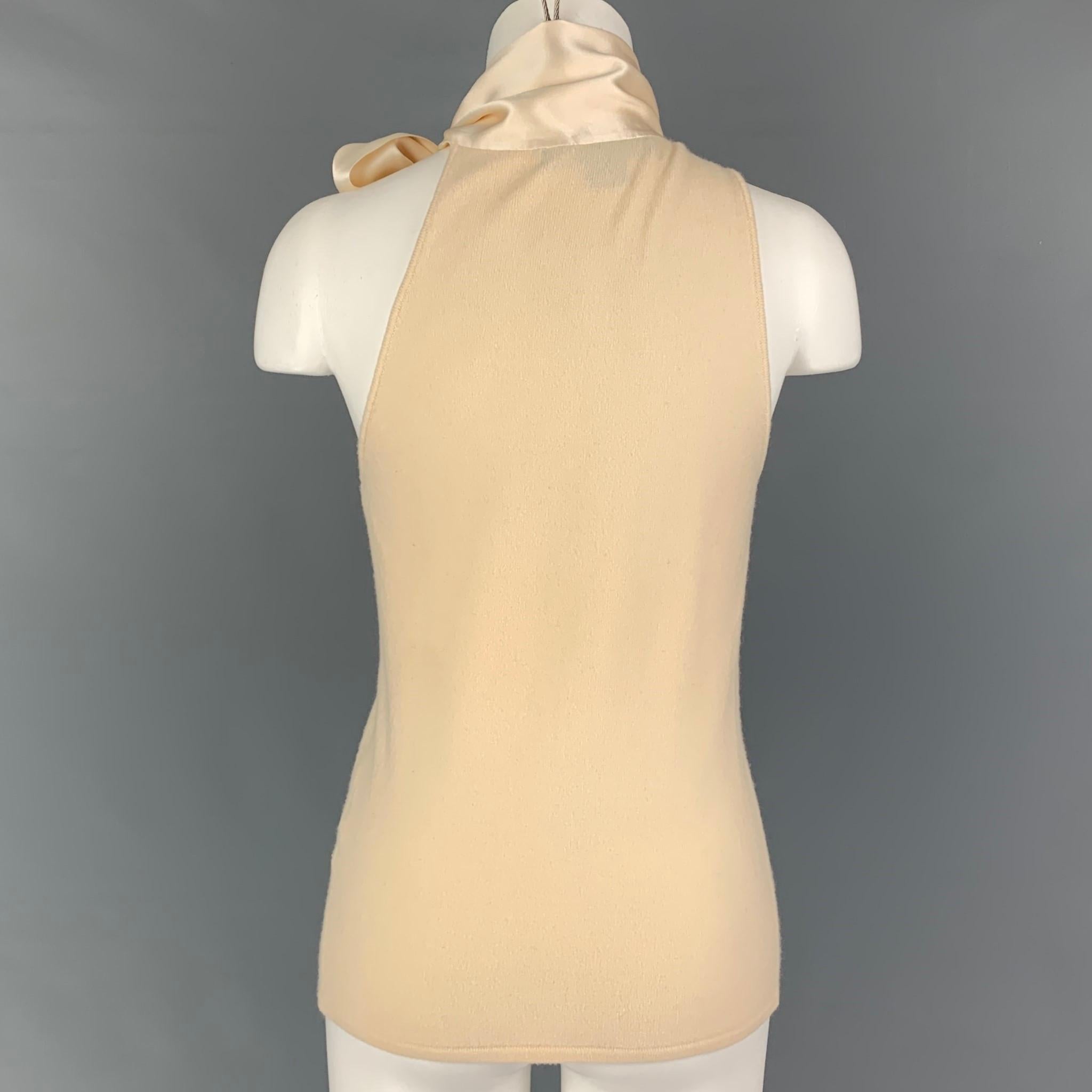 RALPH LAUREN 'Black Label' dress top comes in a cream cashmere featuring a sleeveless style and a self tie silk scarf design.

Very Good Pre-Owned Condition. Fabric tag removed.
Marked: M

Measurements:

Bust: 31 in.
Length: 23 in