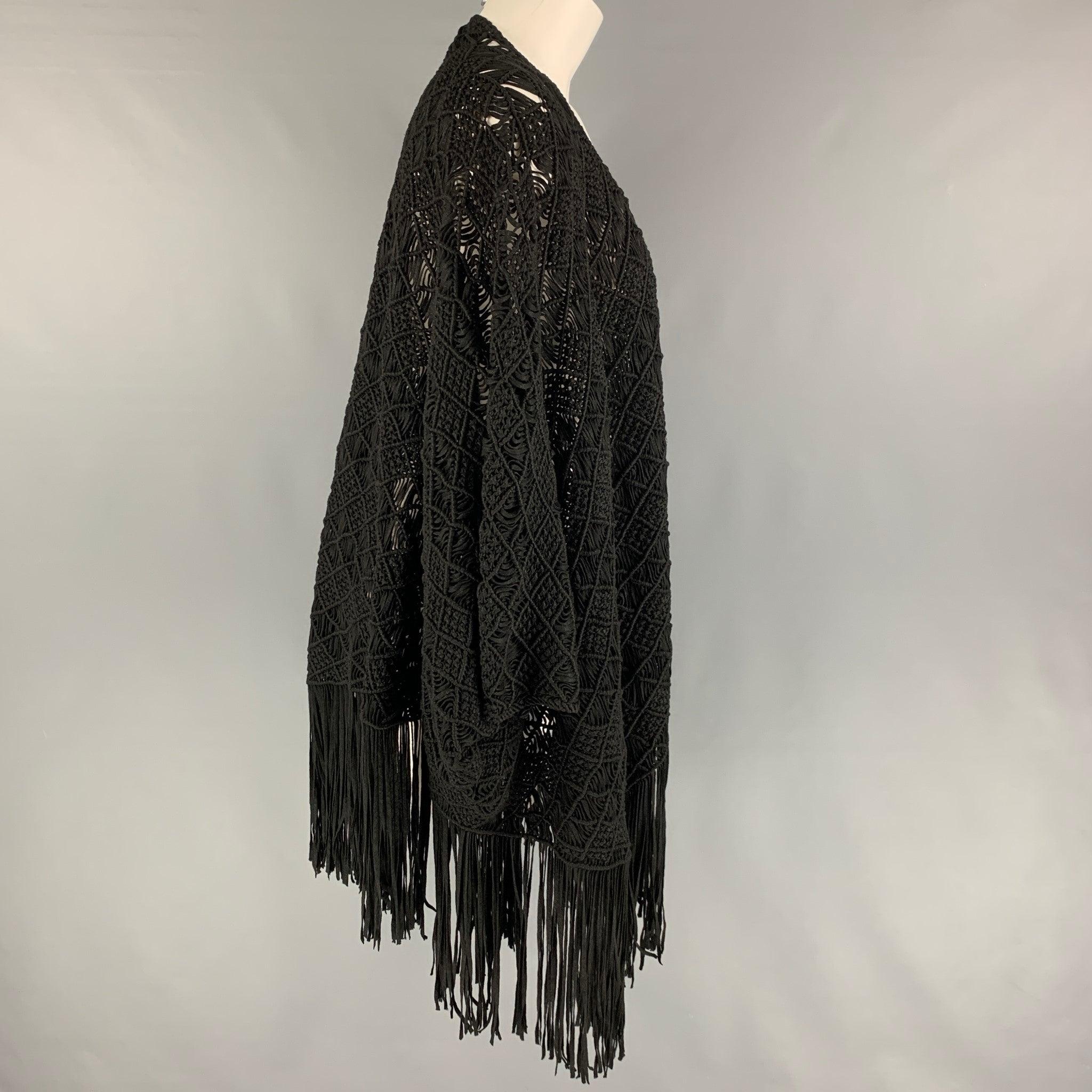 RALPH LAUREN 'Black Label' cape comes in a black knitted viscose / polyester featuring a fringe trim and a open front.
Very Good
Pre-Owned Condition. 

Marked:   M/L 

Measurements: 
 
Shoulder: 57 inches Length: 37 inches 
  
  
 
Reference: