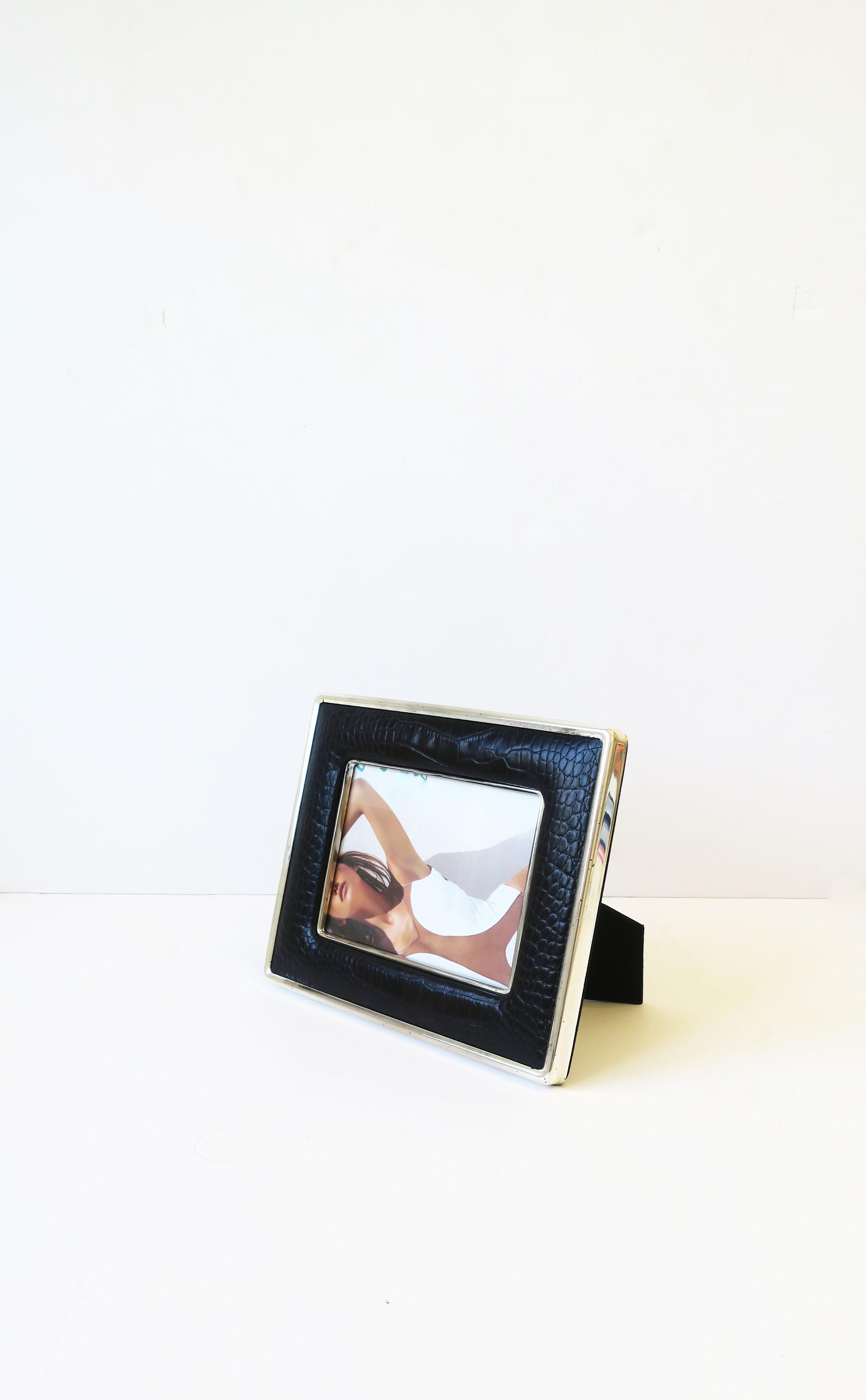 A Ralph Lauren black leather and sterling silver plate picture frame, circa late 20th century. Made in England. A beautiful frame that can be positioned both vertical or horizontal as demonstrated in images. Leather is embossed like crocodile or