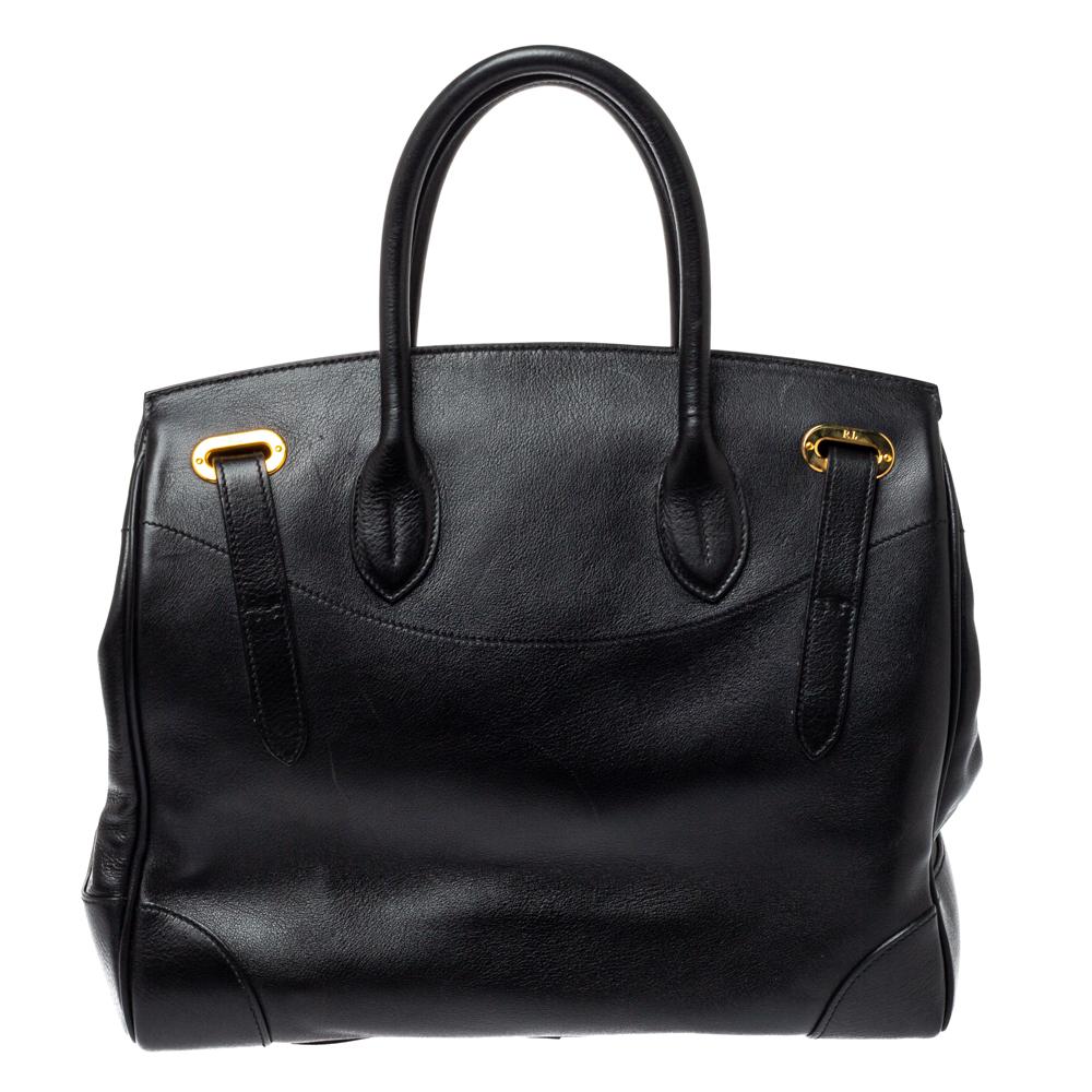 This Ralph Lauren Ricky bag is simply breathtaking. Meticulously crafted from leather, the bag delights not only with its appeal but structure as well. It is held by two top handles, detailed with gold-tone hardware, and equipped with a spacious
