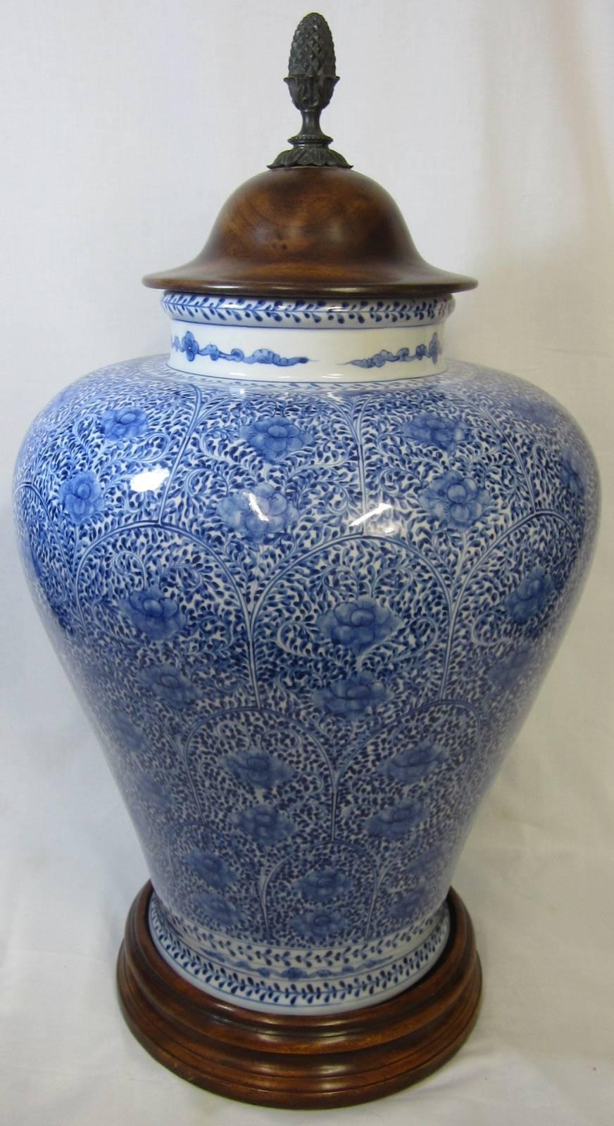 Ralph Lauren Chinese blue and white lidded urn, on a wooden base with a wood lid
No makers marks on the base.