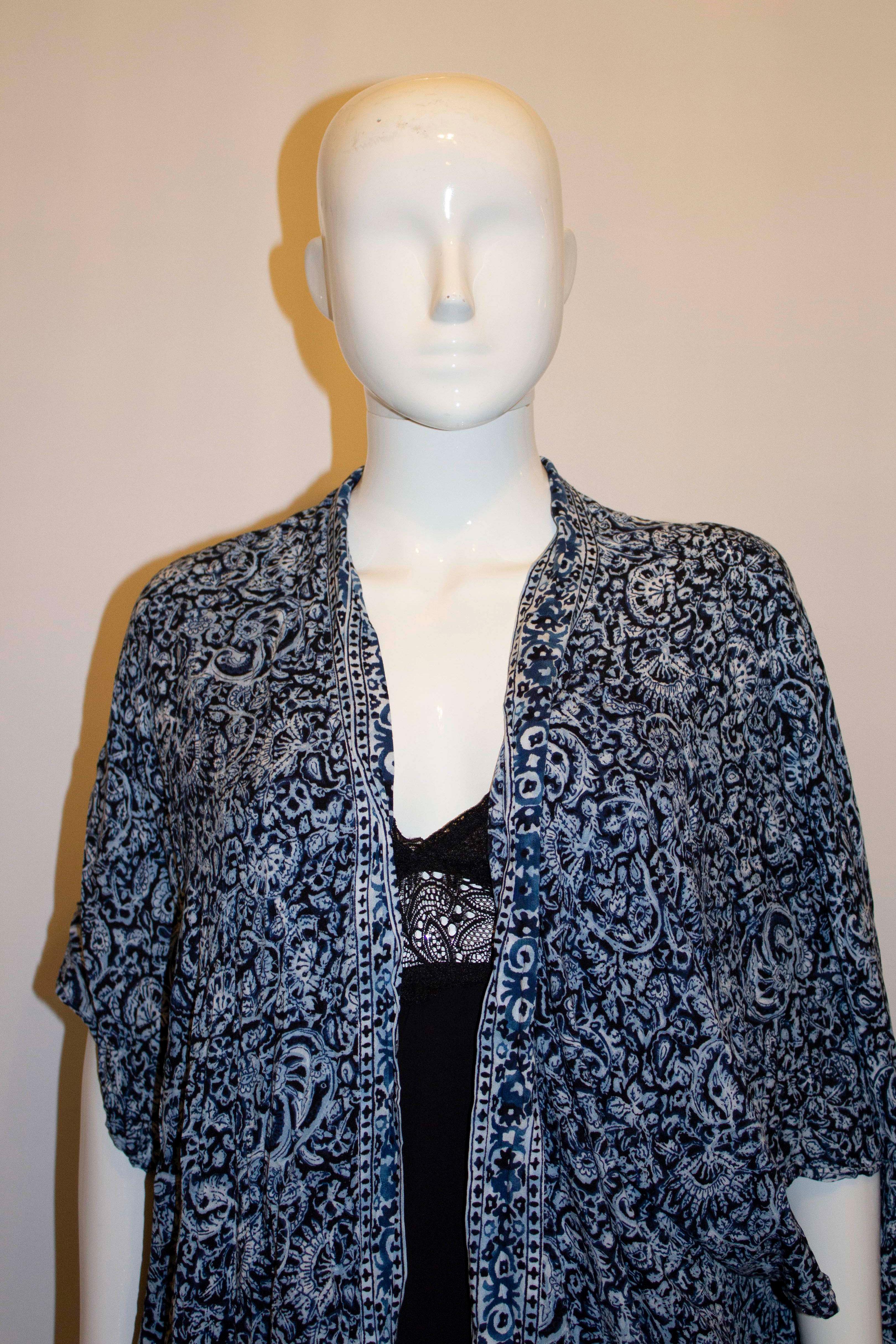 A pretty blue and white summer cover up by Polo , Ralph Lauren. In a blue and white paisley print, the coverup is sleaveless and best worn loose. 
Measurements: Bust up to 38'', length 33''