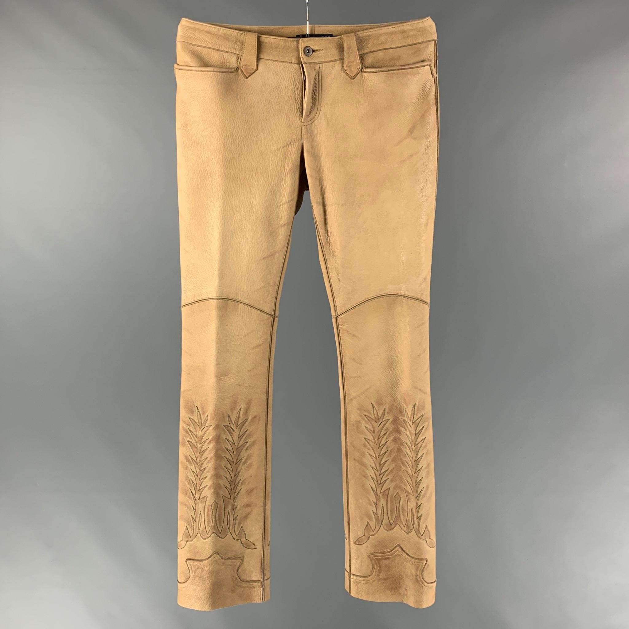 RALPH LAUREN BLUE LABEL by casual pants comes in a beige leather featuring a western style, embroidered detail, and a zip fly closure.

Excellent Pre-Owned Condition.
Marked: 10

Measurements:

Waist: 34 in.
Rise: 9 in.
Inseam: 34 in.  

 