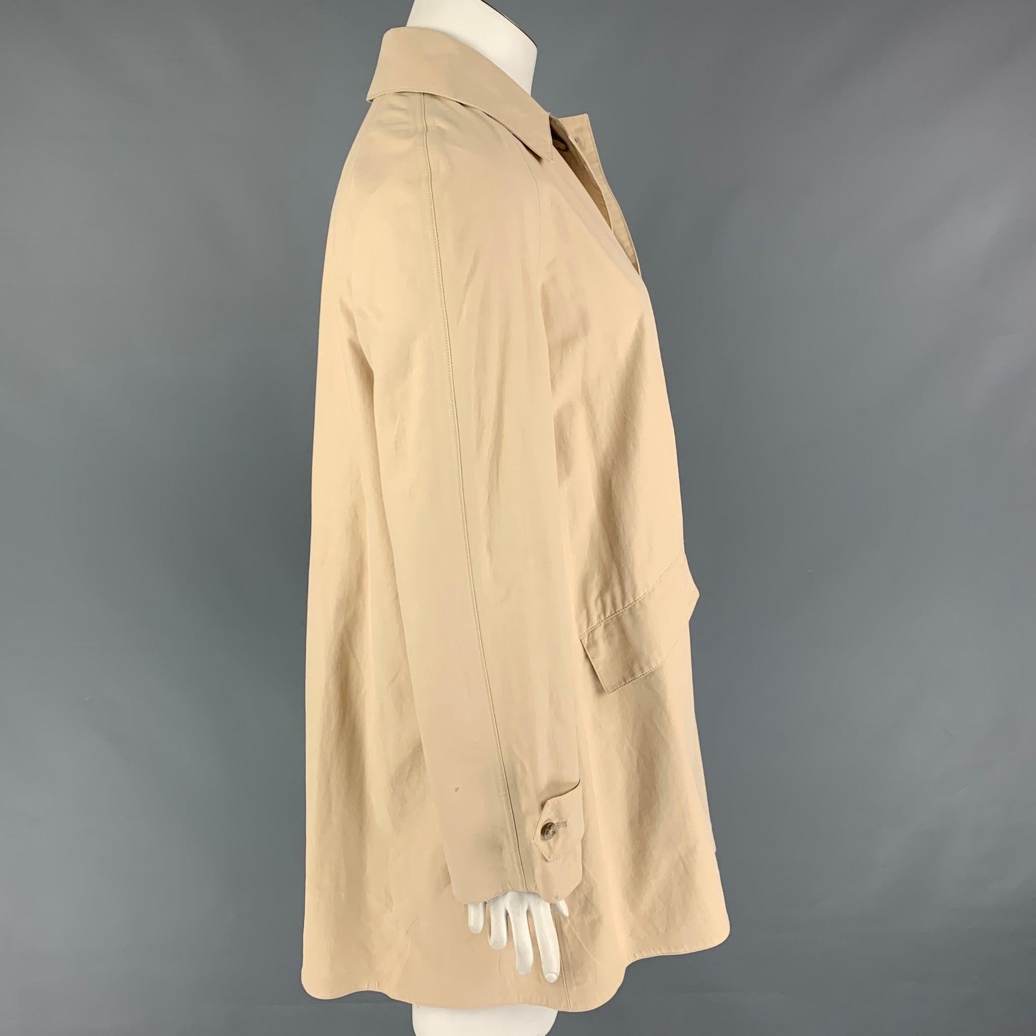 RALPH LAUREN 'Blue Label' coat comes in a beige cotton featuring a spread collar, flap pockets, single back vent, and a hidden placket closure. Made in Italy.
Very Good
Pre-Owned Condition. 

Marked:   10 

Measurements: 
 
Shoulder: 18 inches 