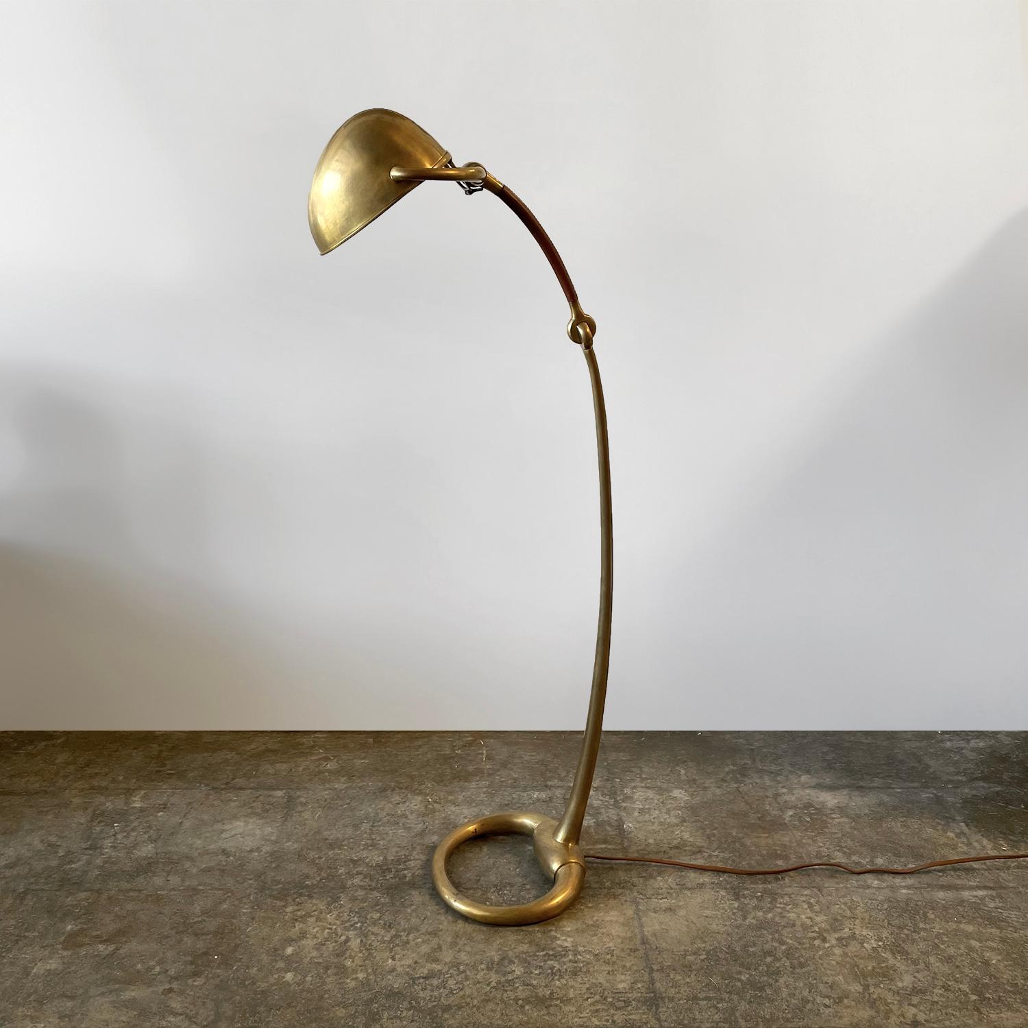 Ralph Lauren brass & leather floor lamp
Equestrian inspired piece
Brass helmet shade articulates to two positions - see photos
Mirrored interior beautifully reflects and illuminates light
Top portion of the brass stem is wrapped in rich saddle