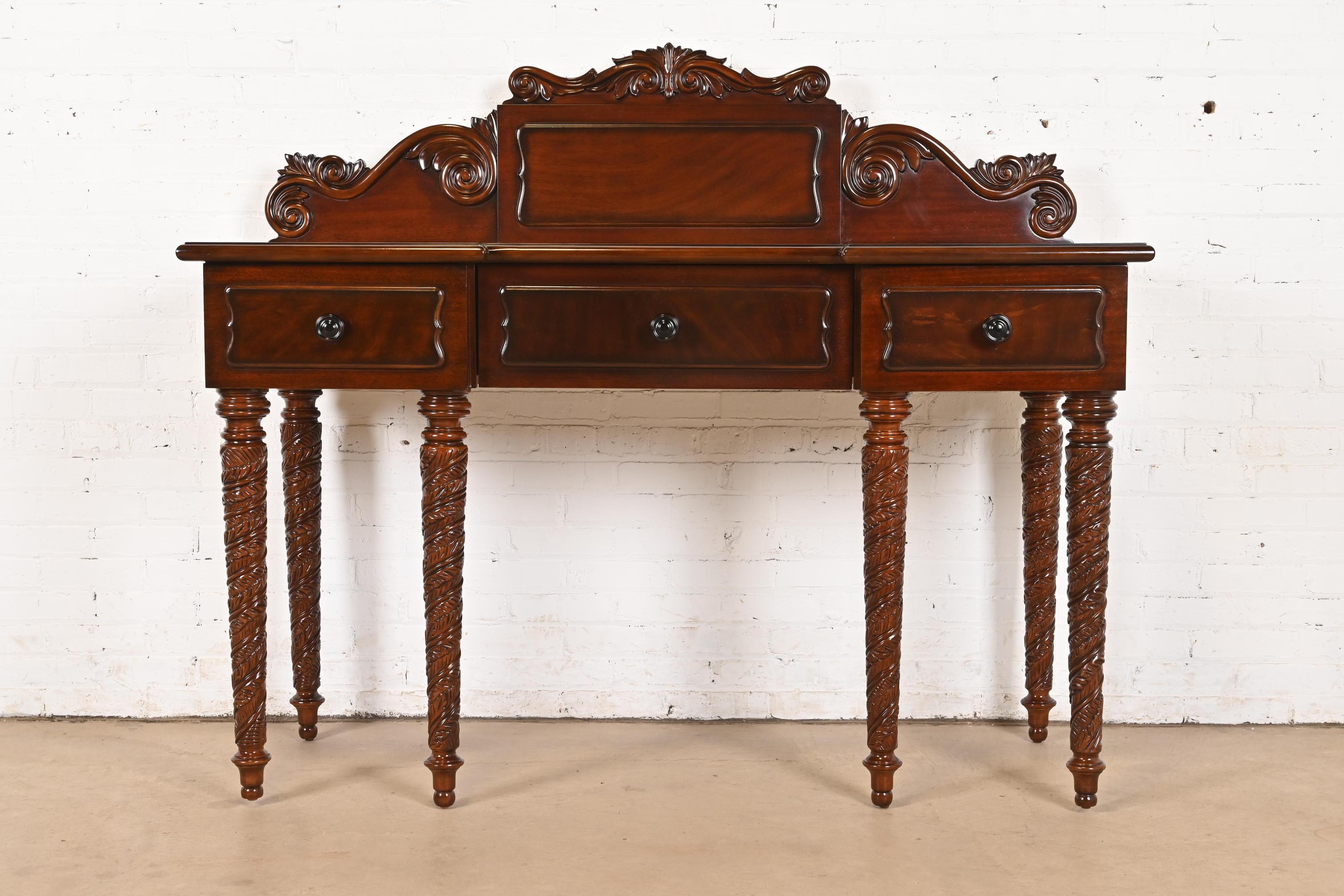 A beautiful British Colonial, American Classical, or Victorian style carved mahogany sideboard, buffet server, or console table

By Ralph Lauren

Circa Late 20th Century

Measures: 63