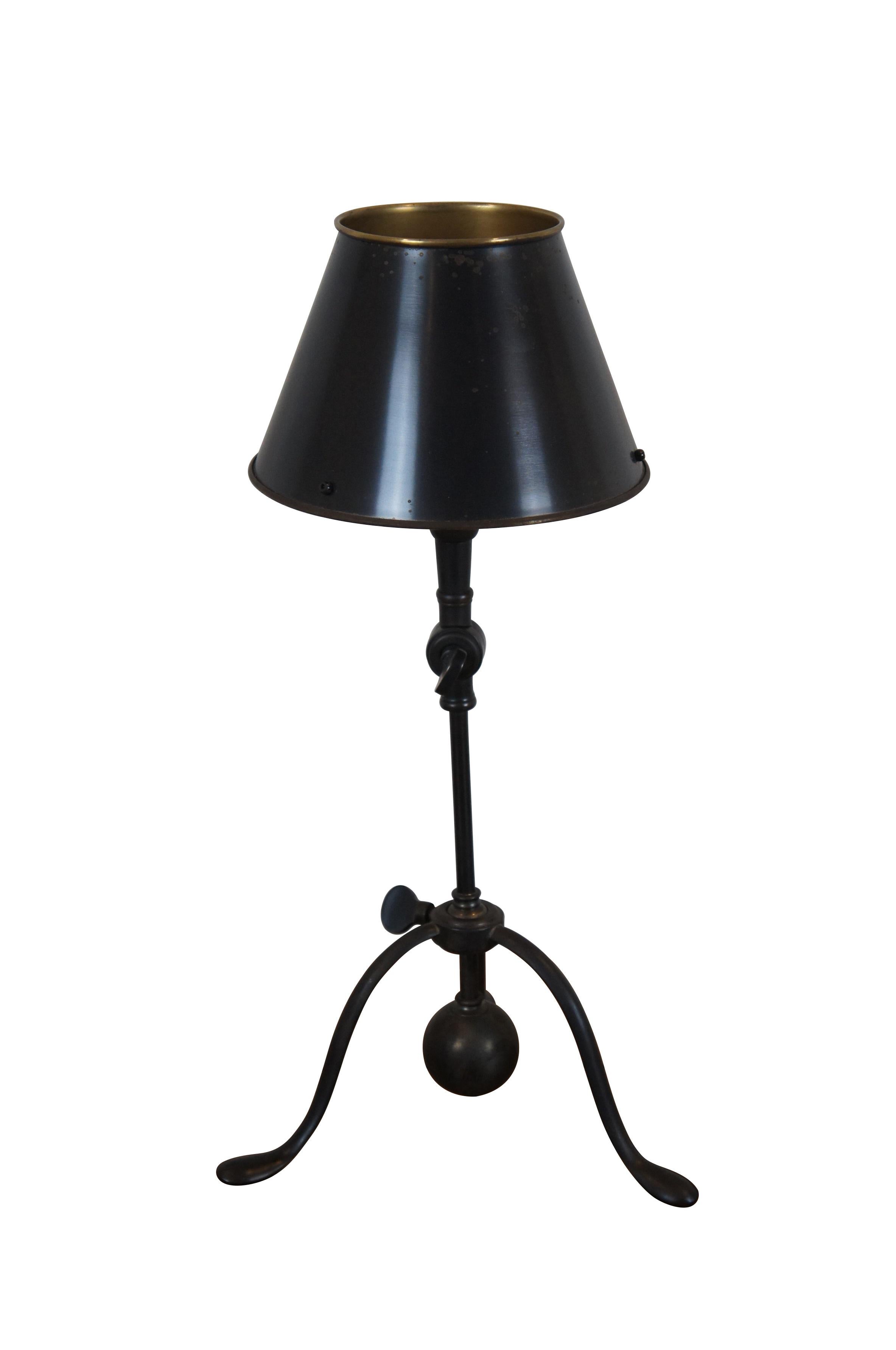 Late 20th century desk / table lamp by Ralph Lauren.  Features a tripod pad foot base and two points of articulation to adjust the angle of the light. Black / oiled bronze finish. Black painted brass shade.

Dimensions:
9.5