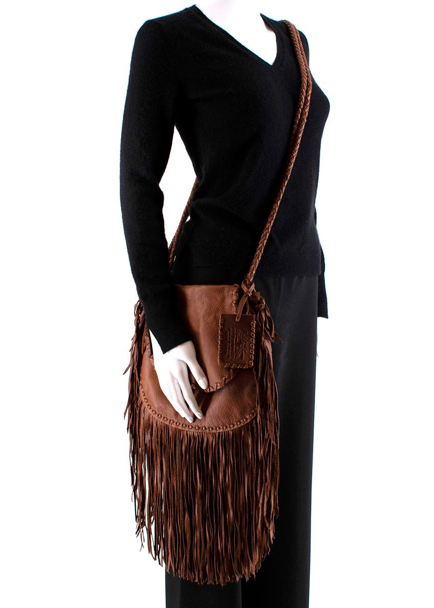 Ralph Lauren Brown Crossbody Leather Tassel Bag

- Tan Leather (Calf)
- Buttoned Closure
- Designer Colour: Tan
- Fringed Detail 


- Height: 26cm 
- Width: 20cm