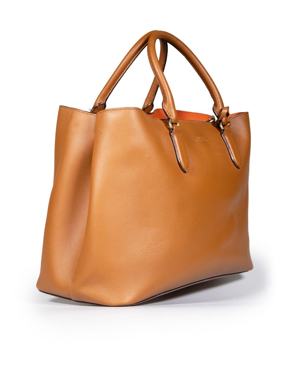 CONDITION is Very good. Minimal wear to the bag is evident. Abrasion and marks on the front, back, base, both handles and inside of the bag. Tarnishing and scratching to the hardware across this used Ralph Lauren designer resale item.
 
 
 
