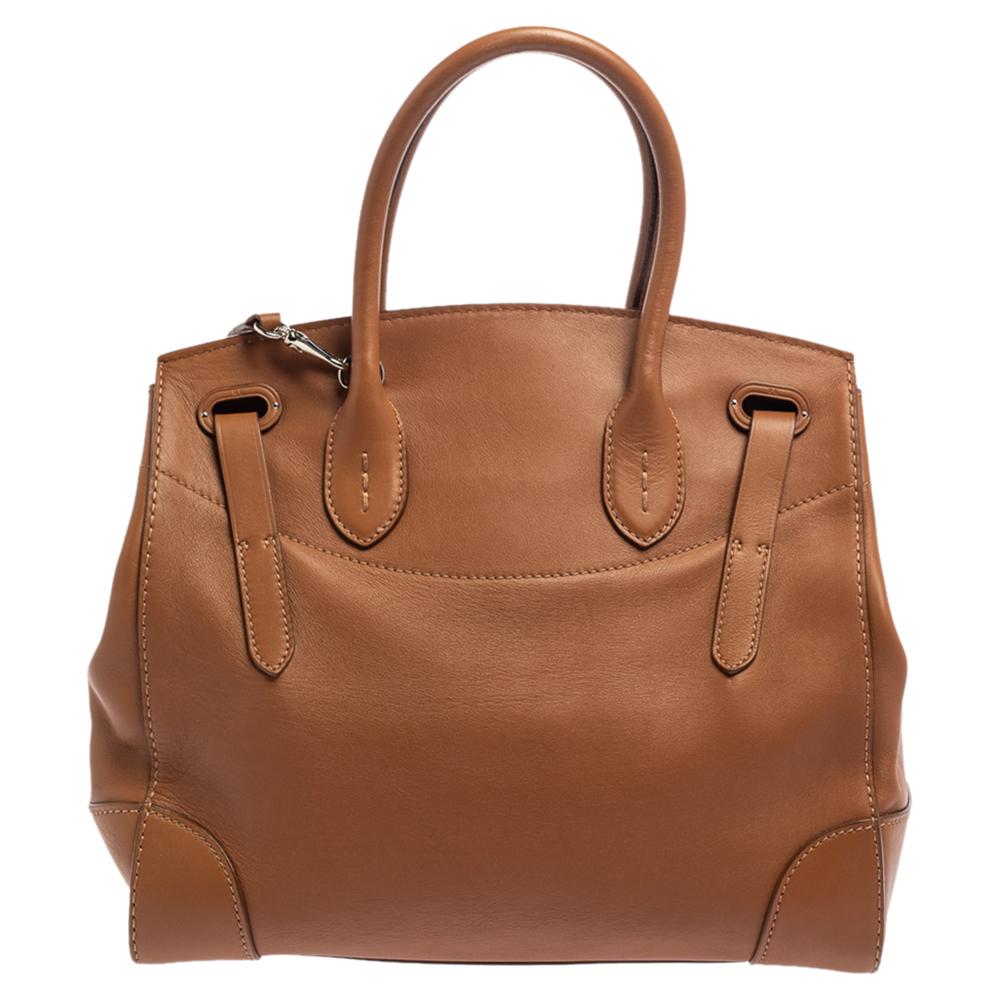 This Ralph Lauren Ricky 33 tote is simply luxe! Meticulously crafted from soft leather, the bag delights not only with its appeal but structure as well. It is held by two top handles, detailed with silver-tone hardware, and equipped with a spacious