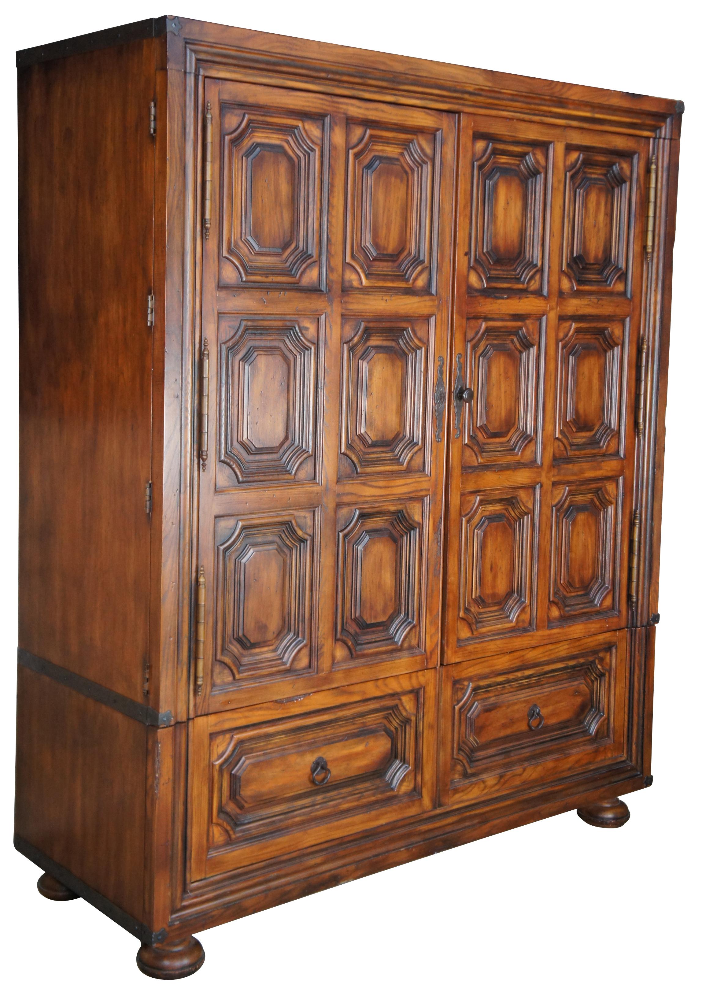 Henredon for Ralph Lauren 1301-05 Sheltering Sky armoire. Made from oak with a British Colonial / West Indies inspired paneled front and old world hardware. Features bi hinge doors, two large drawers and bun feet. Great for use as a linen press, tv