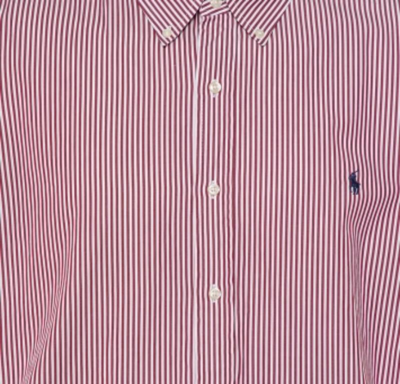 Exhibiting the fine tailoring of Ralph Lauren, this classic shirt with perfect fitting must be added to your formal closet. It is fabricated in cotton and adorned with an appealing striped pattern. It has a button front closure and long sleeves for