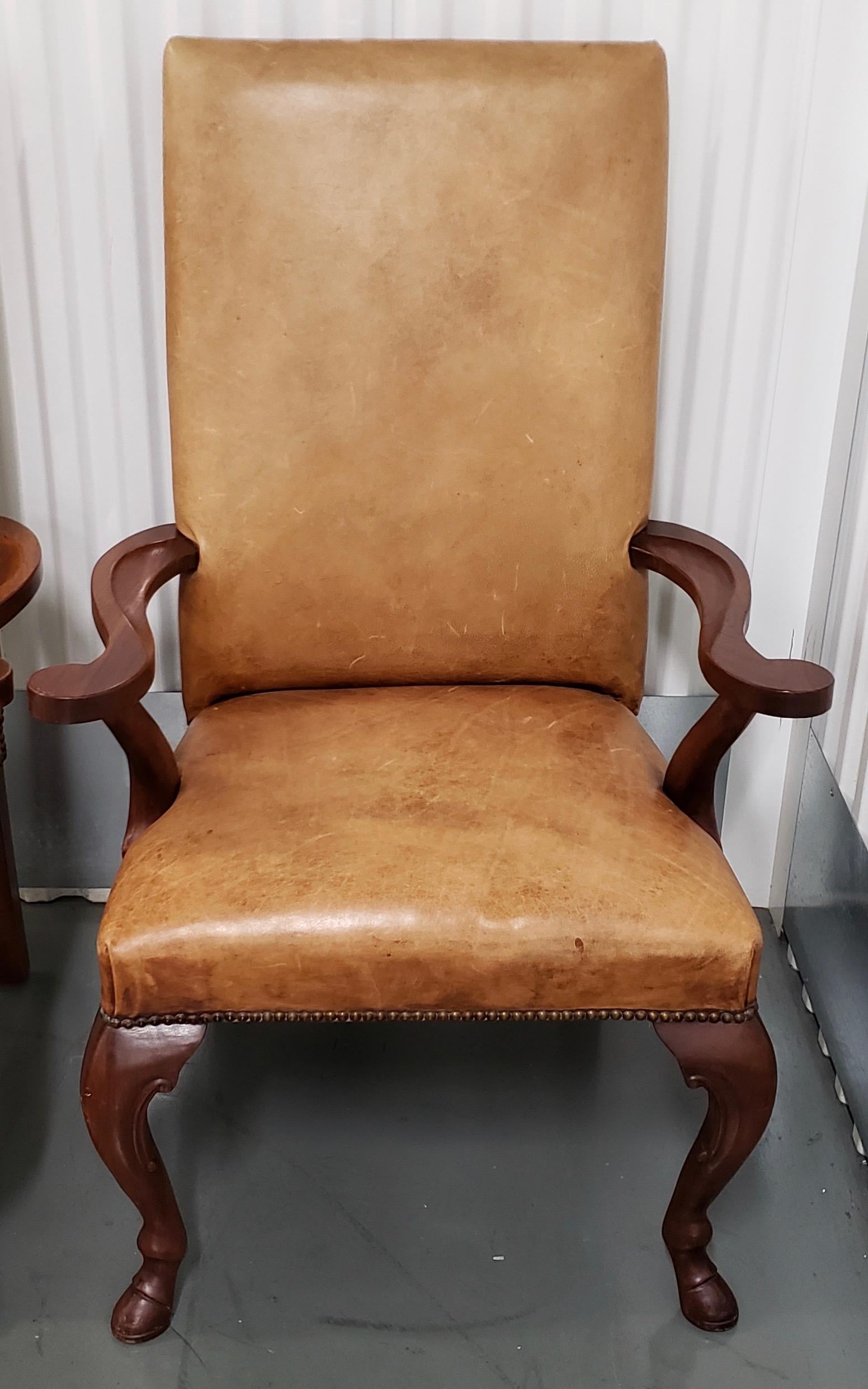 Ralph Lauren carved mahogany and leather upholstered armchairs with hoofed feet

Fantastic pair of carved mahogany arm chairs by Ralph Lauren. 

The leather is affixed to the frames with brass tacks.

Dimensions 28.75