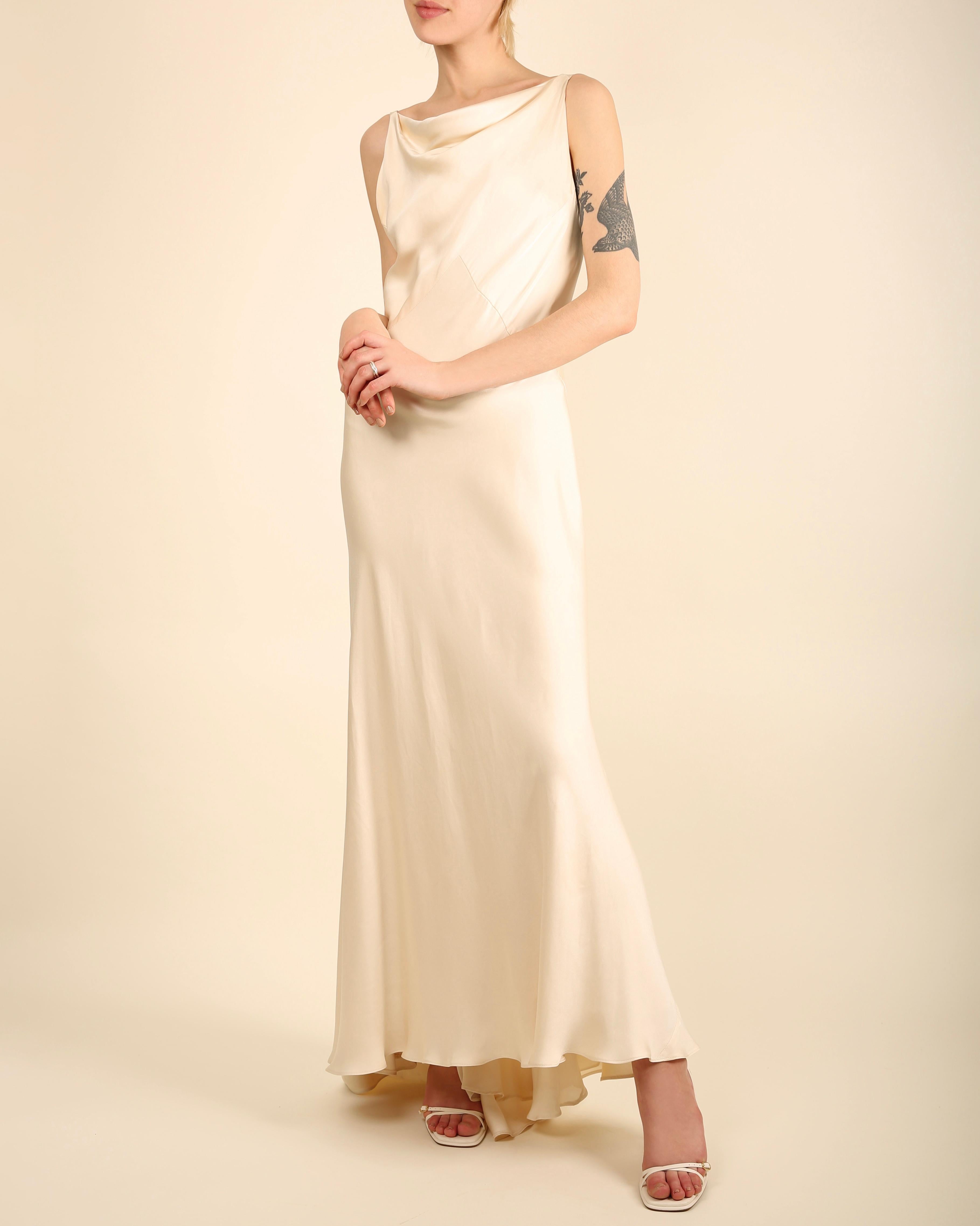 LOVE LALI Vintage

Ralph Lauren Collection (Purple Label) champagne coloured slinky sleeveless silk gown
Draped neckline
Cut on the bias so it skims the silhouette of the body just beautifully - this also allows the dress some stretch 
Backless
