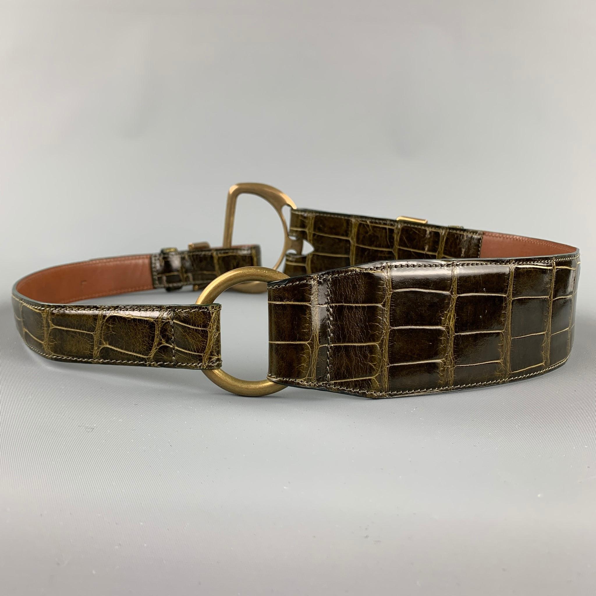 RALPH LAUREN Collection 2006 belt comes in a brown alligator featuring a brass hardware and a double buckle. Comes with dust bag. Made in Italy.

Very Good Pre-Owned Condition.
Marked: L
Original Retail Price: $1,475.00

Length: 43 in.
Width: 2