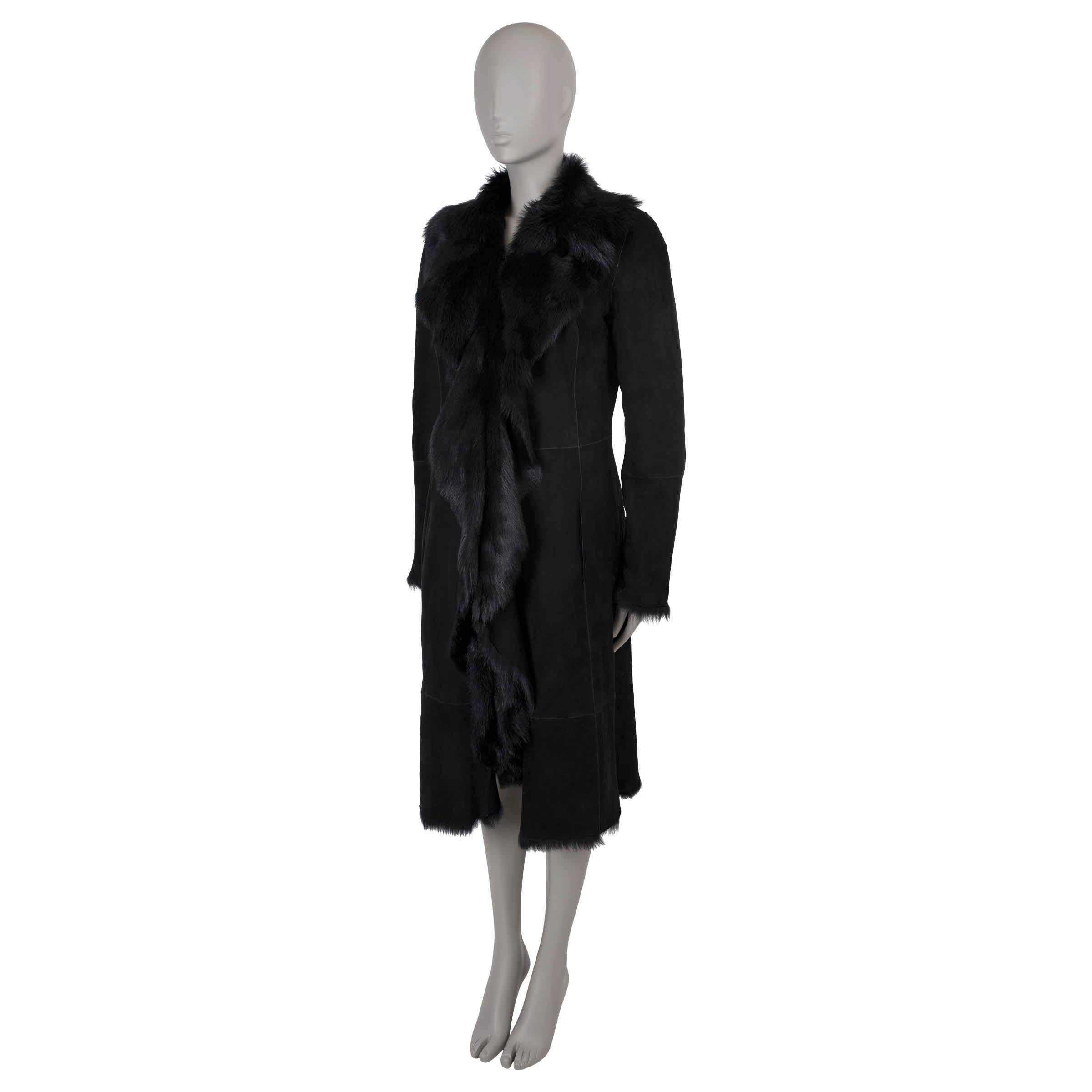 This 100% authentic Ralph Lauren Collection shearling coat is crafted from black suede and fully lined with luxurious long hair lamb fur that has a slight shine for added sophistication. The coat features an oversized shawl collar, visible panel
