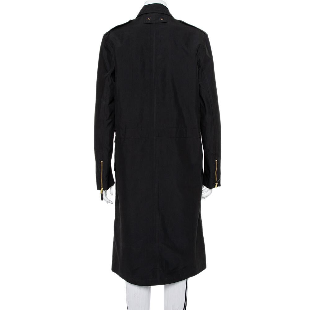 Upgrade your wardrobe with this fabulous coat from Ralph Lauren Collection. The black creation is made of quality fabrics and features pockets on the front, gold-tone hardware detailing, long sleeves, and concealed zip fastening. Sure to lend you a