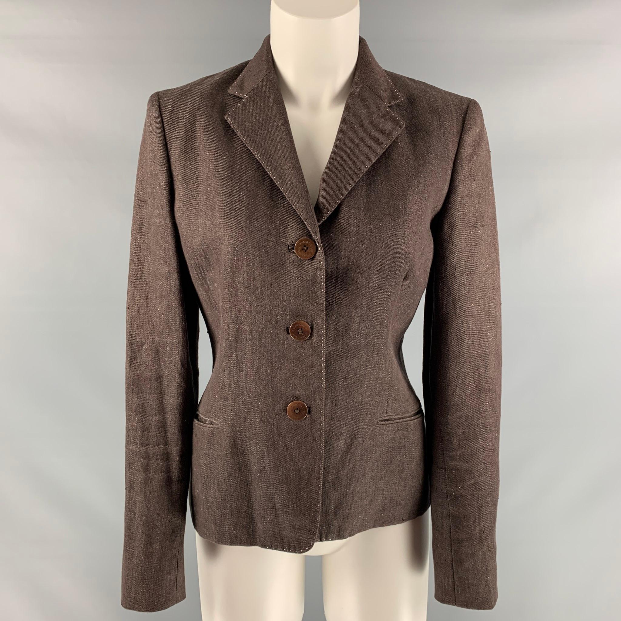 RALPH LAUREN 'COLLECTION by' blazer comes in brown linen twill fabric featuring a button down closure, two slit pockets at front and contrast top stitch details. Made in USA.

Excellent Pre-Owned Condition.
Marked: 6

Measurements:

Shoulder: 15.5
