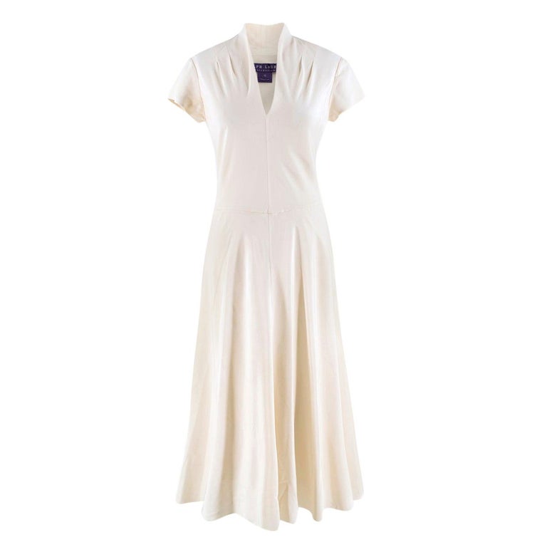 ralph lauren cream dress From sheer raglan sleeves to a halter gown tied in cream satin, # RalphLauren's evening details tell a story of pure romance and sophistication. Shop the #RLCollection Chilton Stretch Satin Evening Dress and