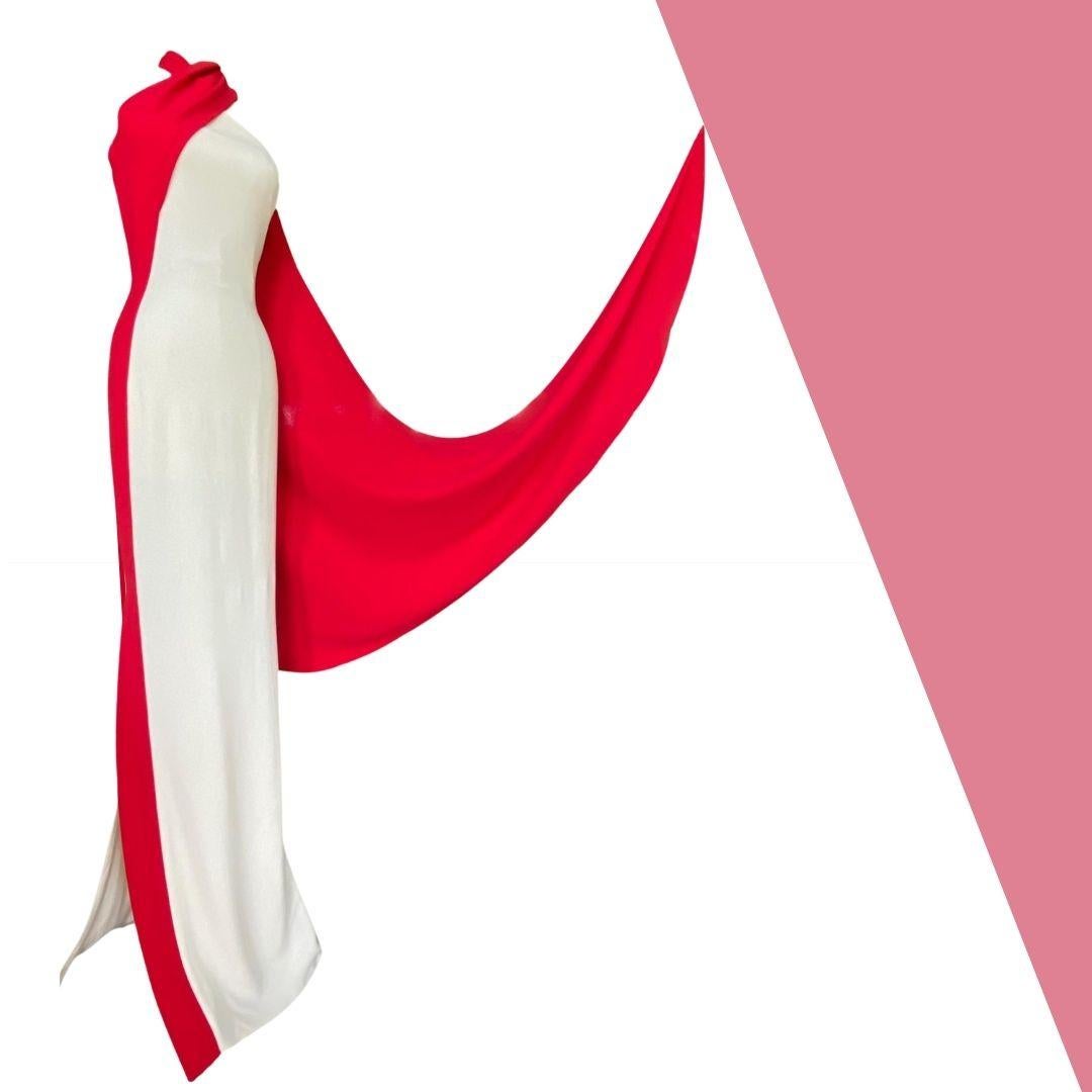 Ralph Lauren Purple Label - Full length white evening gown with dramatic red flowing attached scarf.  The simplistic beauty of this gown is striking and elegant.  The fabric is white crepe and the inner lining is silk.  This dress has an invisible