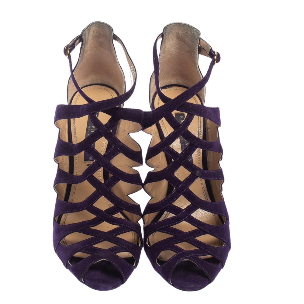 Walk with panache in these lovely purple sandals from Ralph Lauren Collection. They are crafted from suede and styled in a cage silhouette with buckled ankle straps. They come endowed with comfortable leather insoles and stand tall on 10 cm