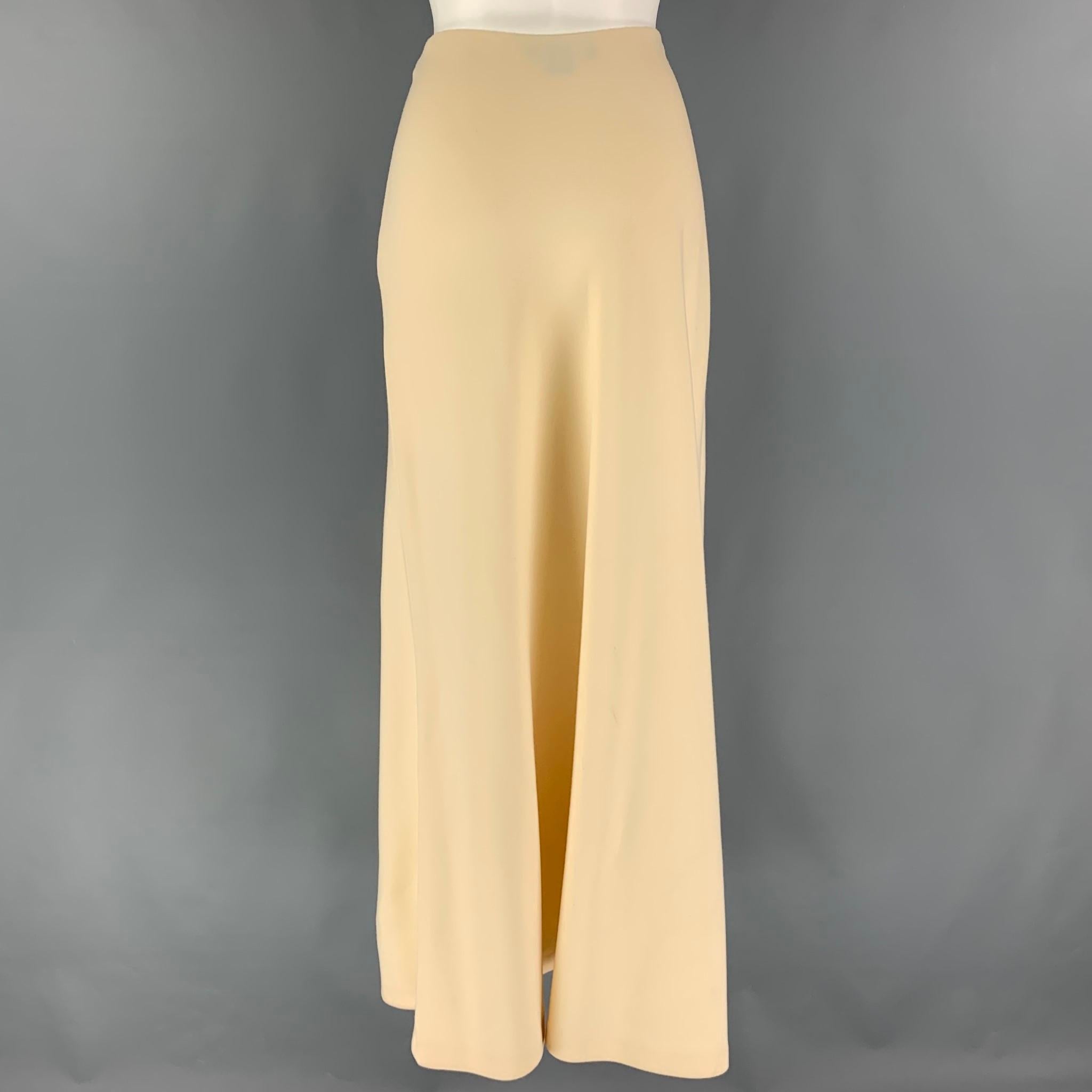 RALPH LAUREN Collection long skirt comes in a cream wool featuring an a-line style and a side zip up closure. Made in USA. 

Very Good Pre-Owned Condition.
Marked: 10

Measurements:

Waist: 30 in.
Hip: 40 in.
Length: 40 in. 
