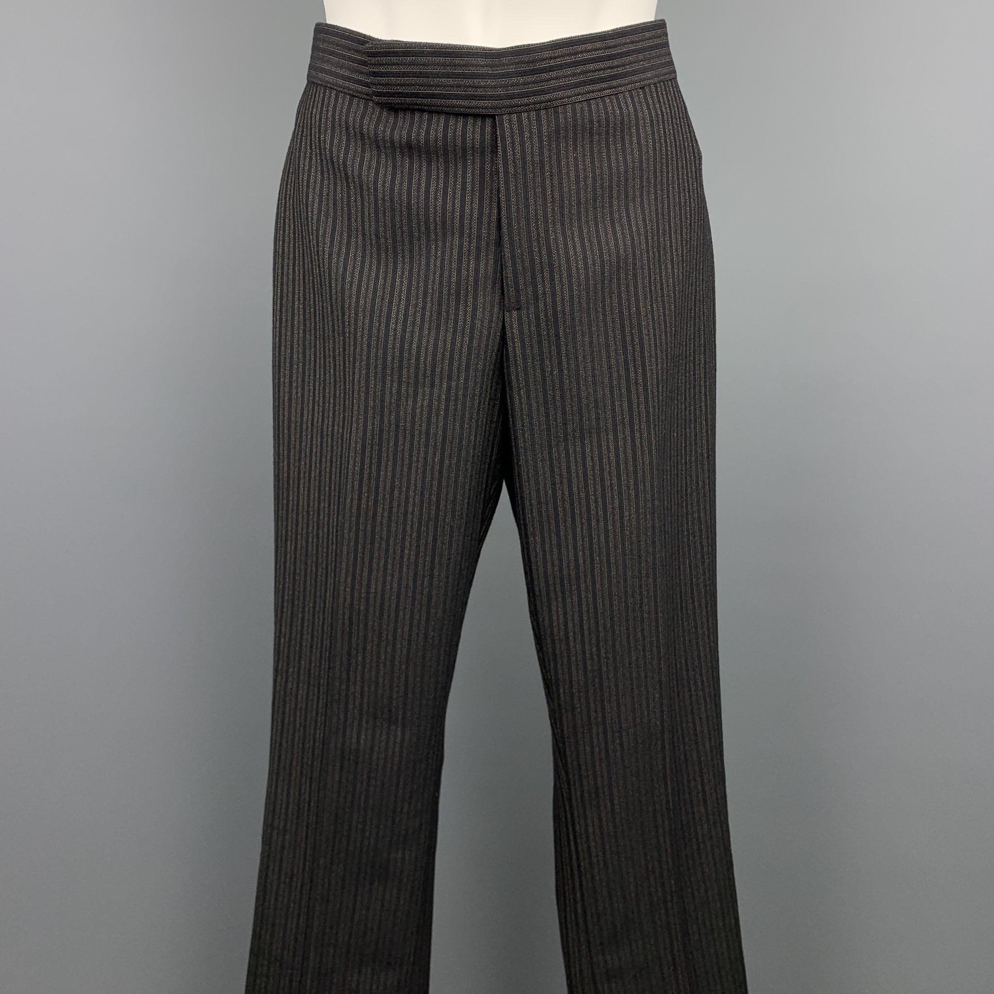 RALPH LAUREN COLLECTION dress pants comes in a black & grey striped wool featuring a straight leg, front tab, and a zip fly closure. Made in USA.

Excellent Pre-Owned Condition.
Marked: US 2

Measurements:

Waist: 27 in. 
Rise: 7 in. 
Inseam: 31 in.