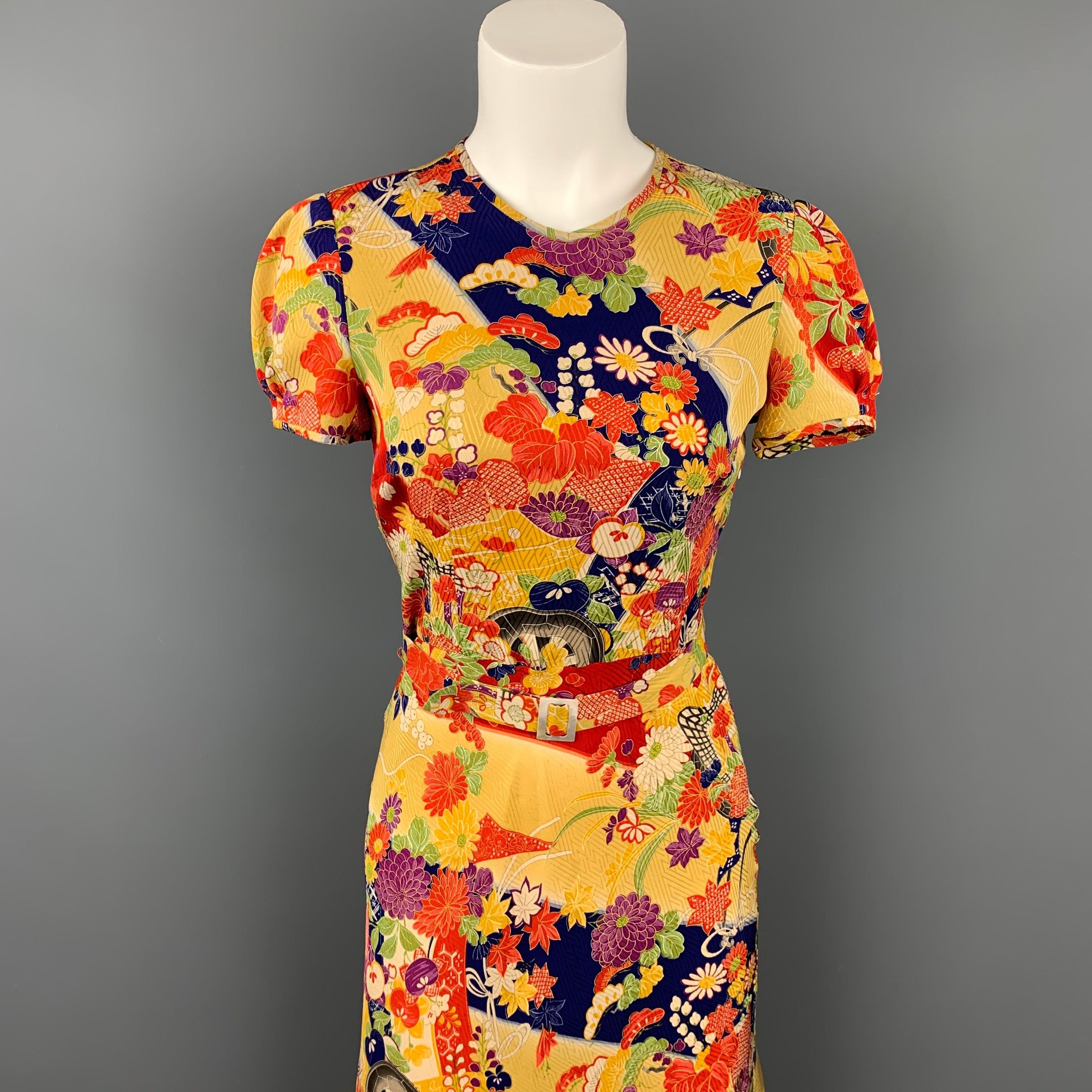 RALPH LAUREN Collection dress comes in a multi-color floral silk featuring a belted style, a-line, and a back button closure. Made in USA.
Very Good Pre-Owned Condition. 

Marked:   2 

Measurements: 
 
Shoulder: 14 inches  Bust: 34 inches  Waist: