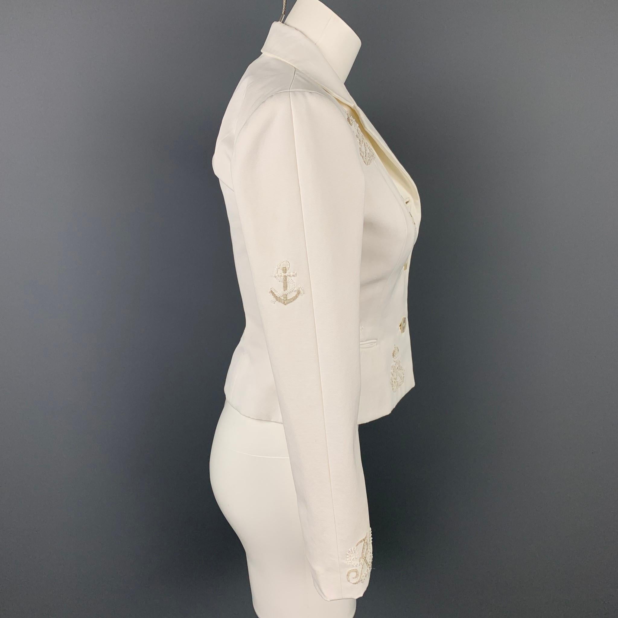 RALPH LAUREN Collection blazer comes in a white cotton with beaded designs featuring a notch lapel, slit pockets, and a buttoned closure. Made in USA.

Very Good Pre-Owned Condition.
Marked: 4

Measurements:

Shoulder: 14 in.
Bust: 32 in.
Sleeve: