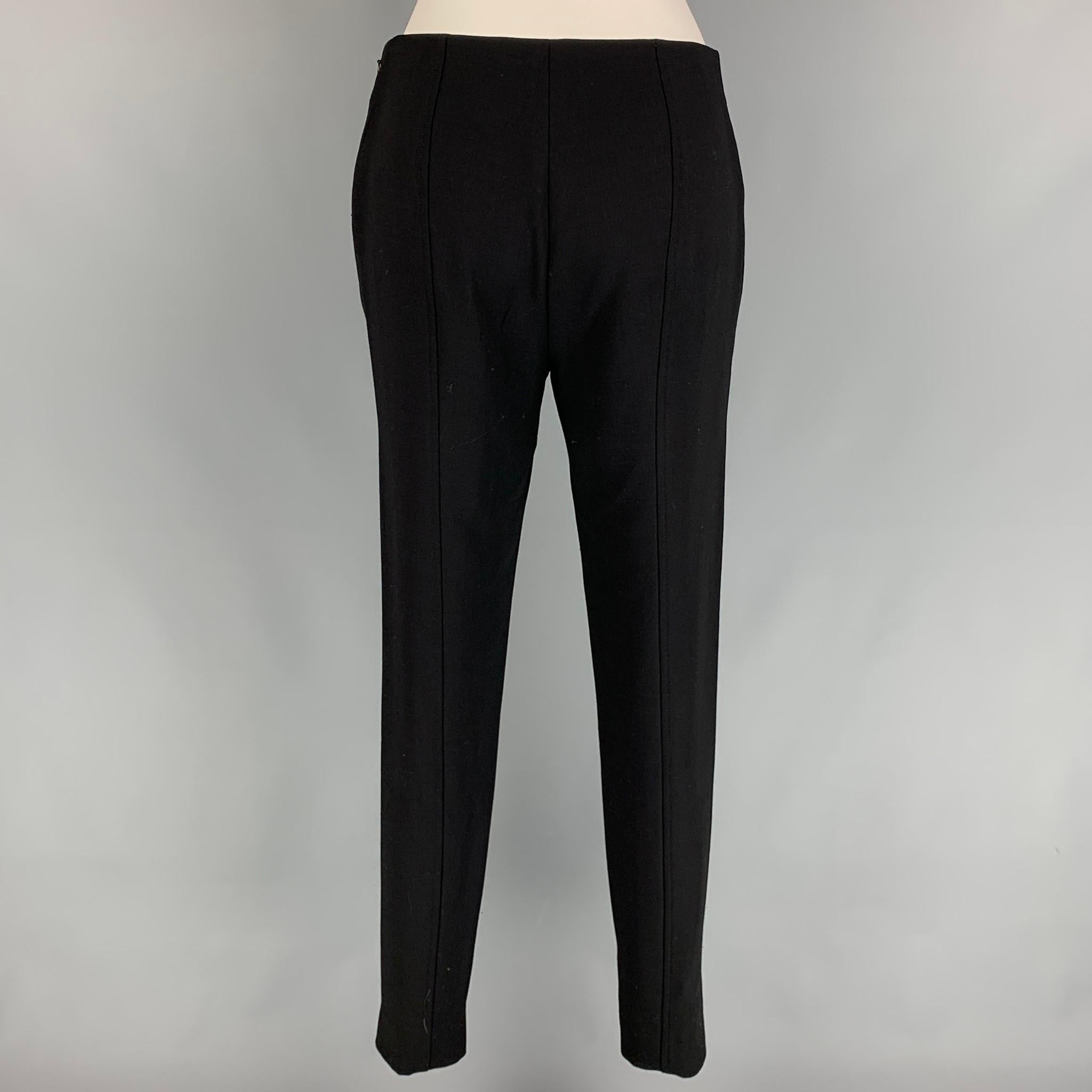 RALPH LAUREN Collection dress pants comes in a black wool featuring a narrow leg, leg zipper details, and a side zipper closure. Made in USA. 

Very Good Pre-Owned Condition.
Marked: 6
Original Retail Price: $995.00

Measurements:

Waist: 28