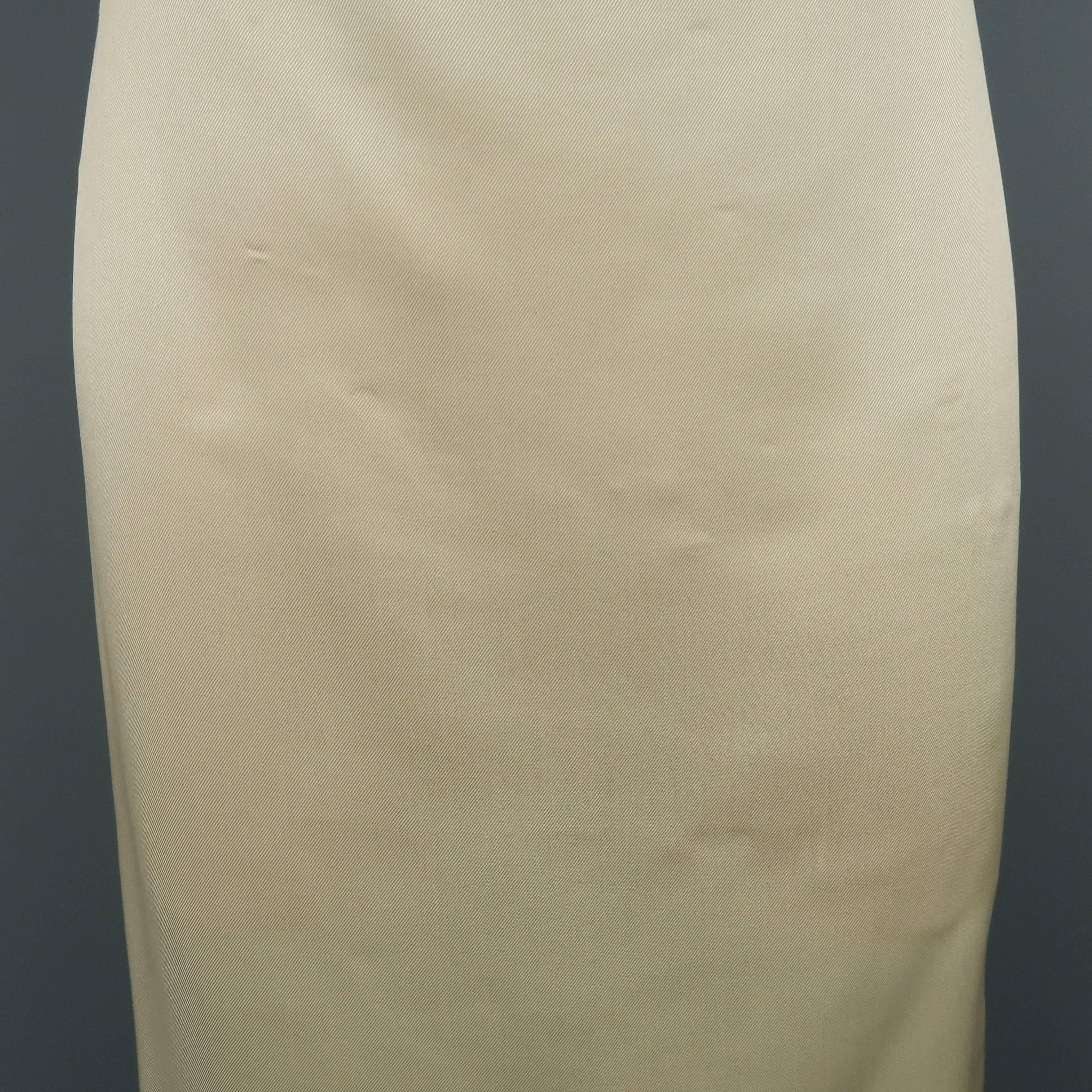 RALPH LAUREN COLLECTION pencil skirt comes in a light beige silk twill with a classic straight silhouette. Wear throughout. As-is. Made in USA.
 
Fair Pre-Owned Condition.
Marked: 6
 
Measurements:
 
Waist: 31 in.
Hip: 38 in.
Length: 25.5 in.
