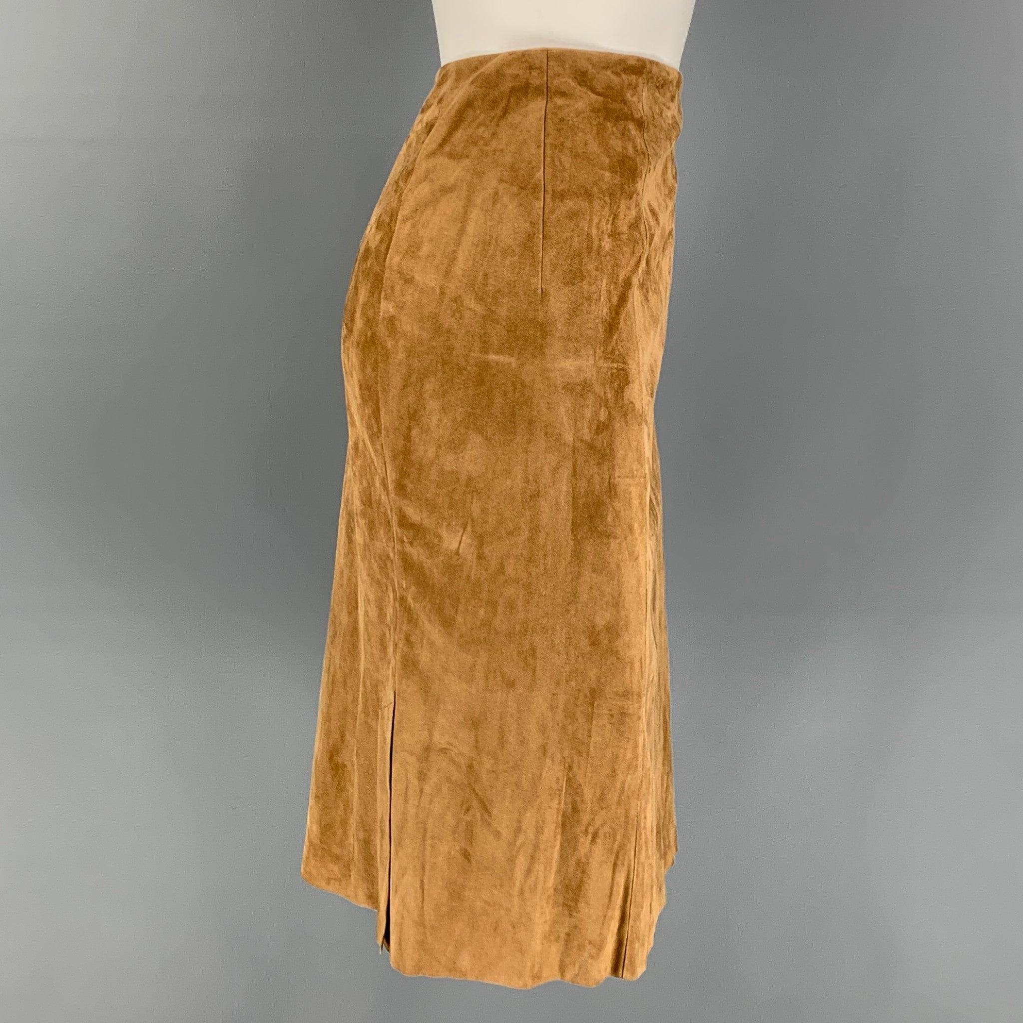 RALPH LAUREN Collection skirt comes in a tan suede featuring a pencil style, double back slits, and a back zip up closure.
Very Good
Pre-Owned Condition. 

Marked:   6 

Measurements: 
  Waist: 29 inches  Hip: 36 inches  Length: 24 inches 
  
  
