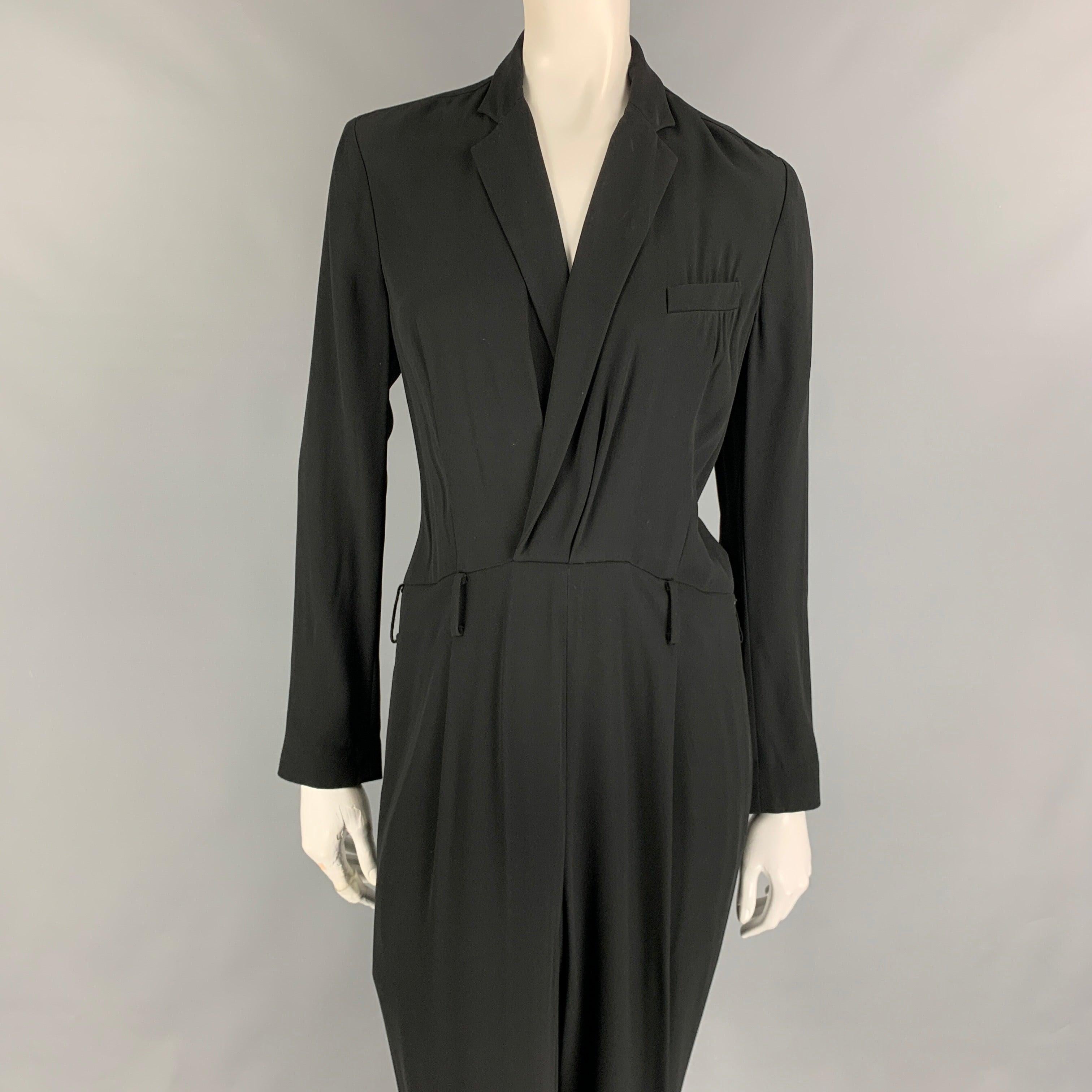 RALPH LAUREN Collection jumpsuit comes in a black viscose / acetate featuring a notch lapel, loose fit, long sleeves, and a side zipper closure. Made in USA.
Very Good
Pre-Owned Condition. 

Marked:   8 

Measurements: 
 
Shoulder: 16 inches  Bust: