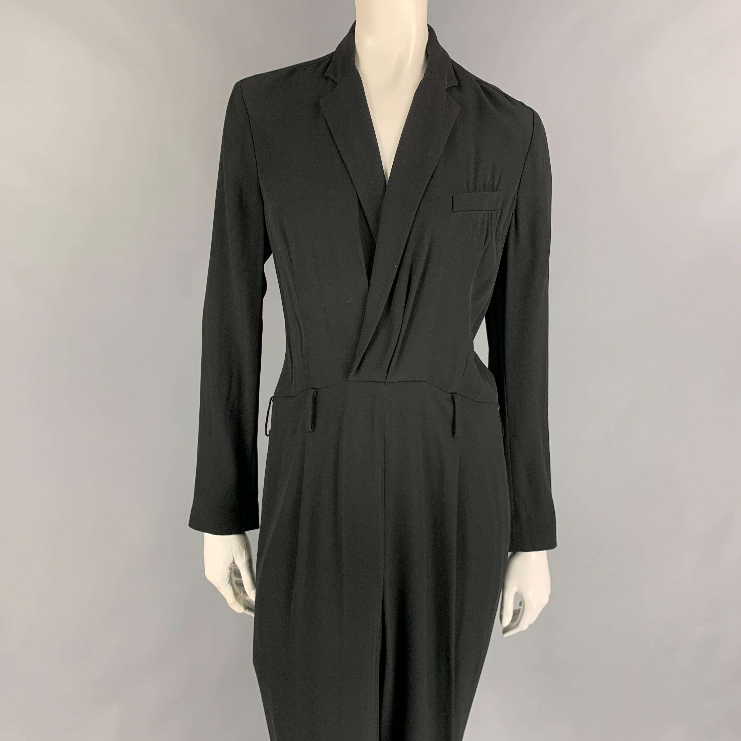 RALPH LAUREN Collection jumpsuit comes in a black viscose / acetate featuring a notch lapel, loose fit, long sleeves, and a side zipper closure. Made in USA. 

Very Good Pre-Owned Condition.
Marked: 8

Measurements:

Shoulder: 16 in.
Bust: 35