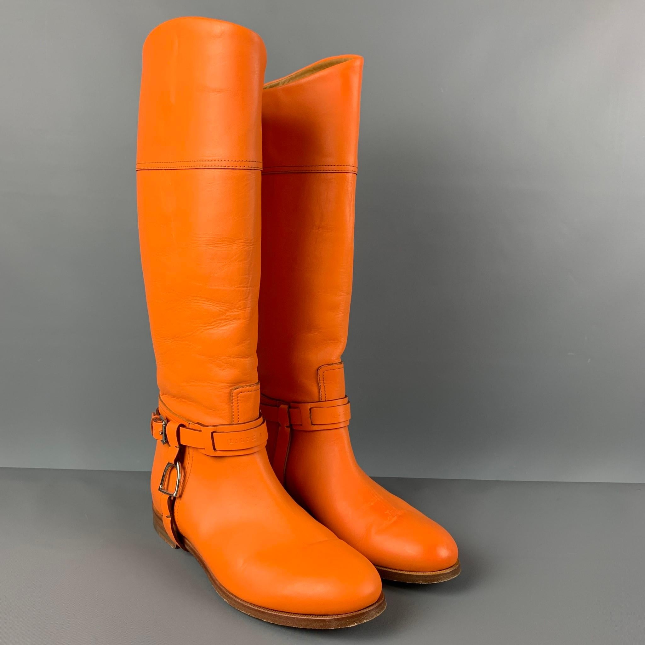 RALPH LAUREN Collection boots comes in a orange leather featuring a riding style, silver tone hardware, and a pull on style. Made in Italy. 

Very Good Pre-Owned Condition.
Marked: 9 B

Measurements:

Length: 10.5 in.
Width: 3.5 in.
Height: 16.5 in. 