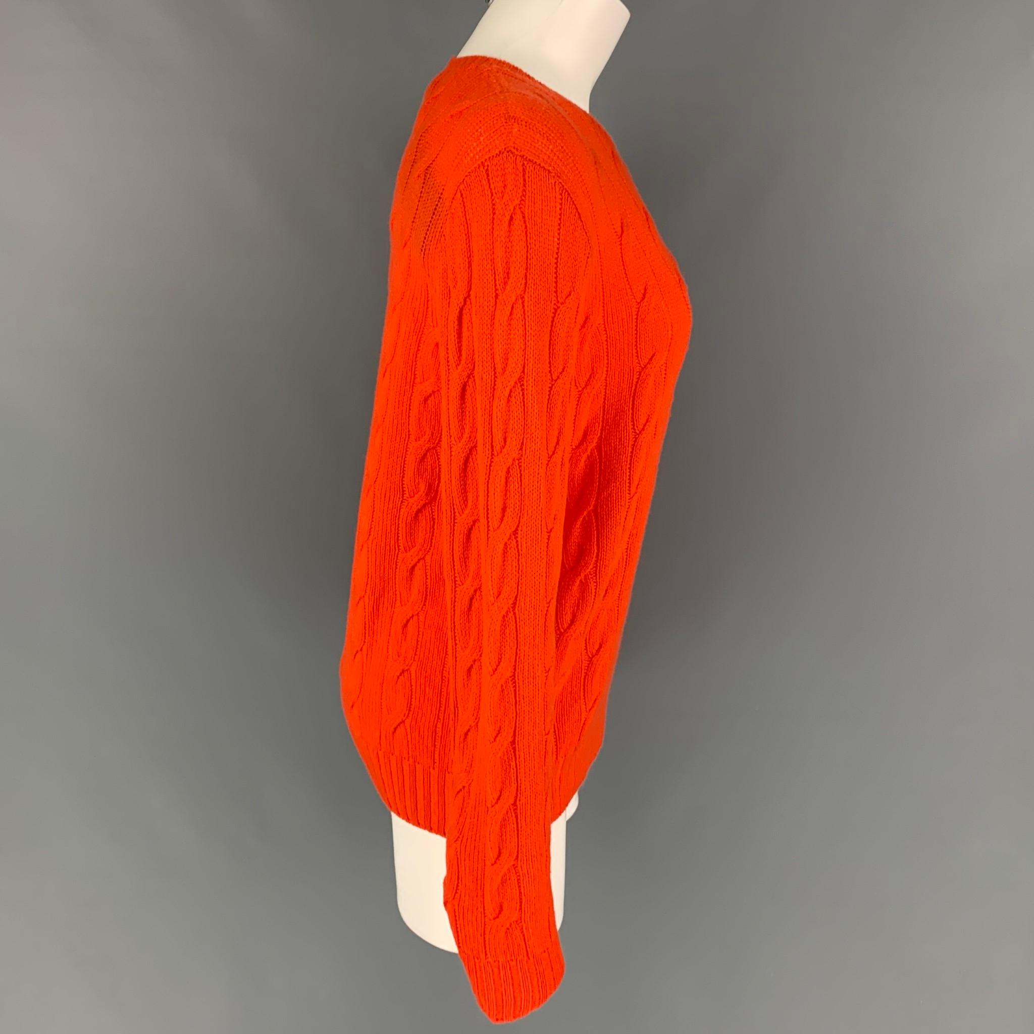 RALPH LAUREN Collection sweater comes in a orange cable knit cashmere featuring a crew-neck. Made in Italy. 

New With Tags.
Marked: L
Original Retail Price: $995.00

Measurements:

Shoulder: 17 in.
Bust: 38 in.
Sleeve: 27 in.
Length: 24.5 in. 