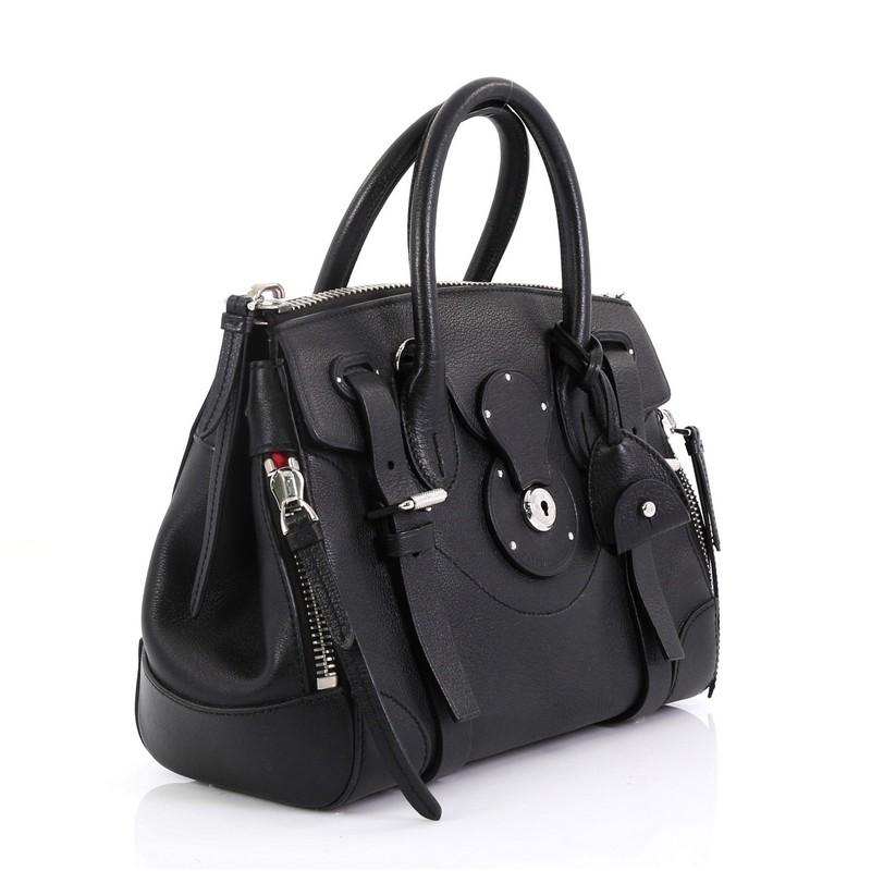 This Ralph Lauren Collection Soft Ricky Zip Handbag Leather 27, crafted from black leather, features dual rolled handles and silver-tone hardware. Its zip closure open to a red fabric interior with zip and slip pockets. 

Estimated Retail Price: