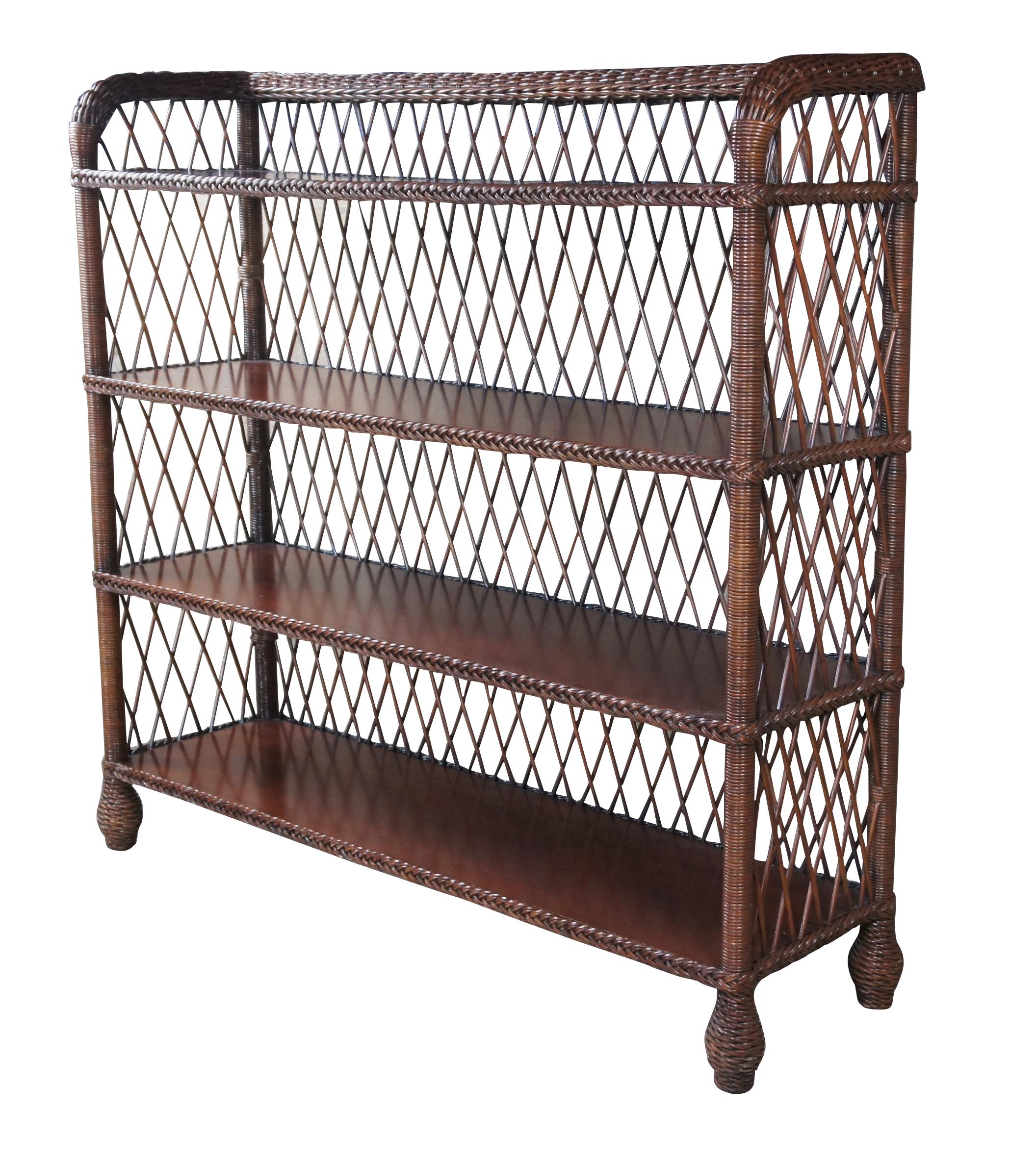 The Conservatory Bookcase by Ralph Lauren is a Modern Bohemian take on Late Victorian and Edwardian styling. Made from Mahogany and braided wicker with lattice back and sides. Includes four shelves over bun feet. 
 
In 1983 Ralph Lauren Home