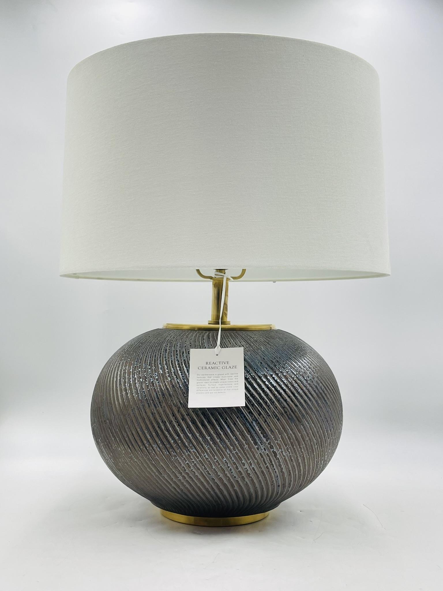 Elevate your interior with this stunning Ralph Lauren Home “Mirelle” table lamp, a sophisticated blend of refined craftsmanship and timeless design. Featuring a reactive ceramic glaze in a deep, textured finish, the Mirelle lamp showcases an