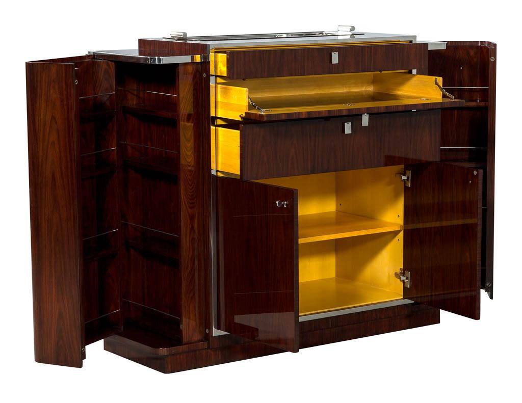 Ralph Lauren Duke Bar Cabinet. 1930s inspired bar cabinet is styled in rich woods with polished stainless steel trim.

Price includes complimentary curb side delivery to the continental USA.