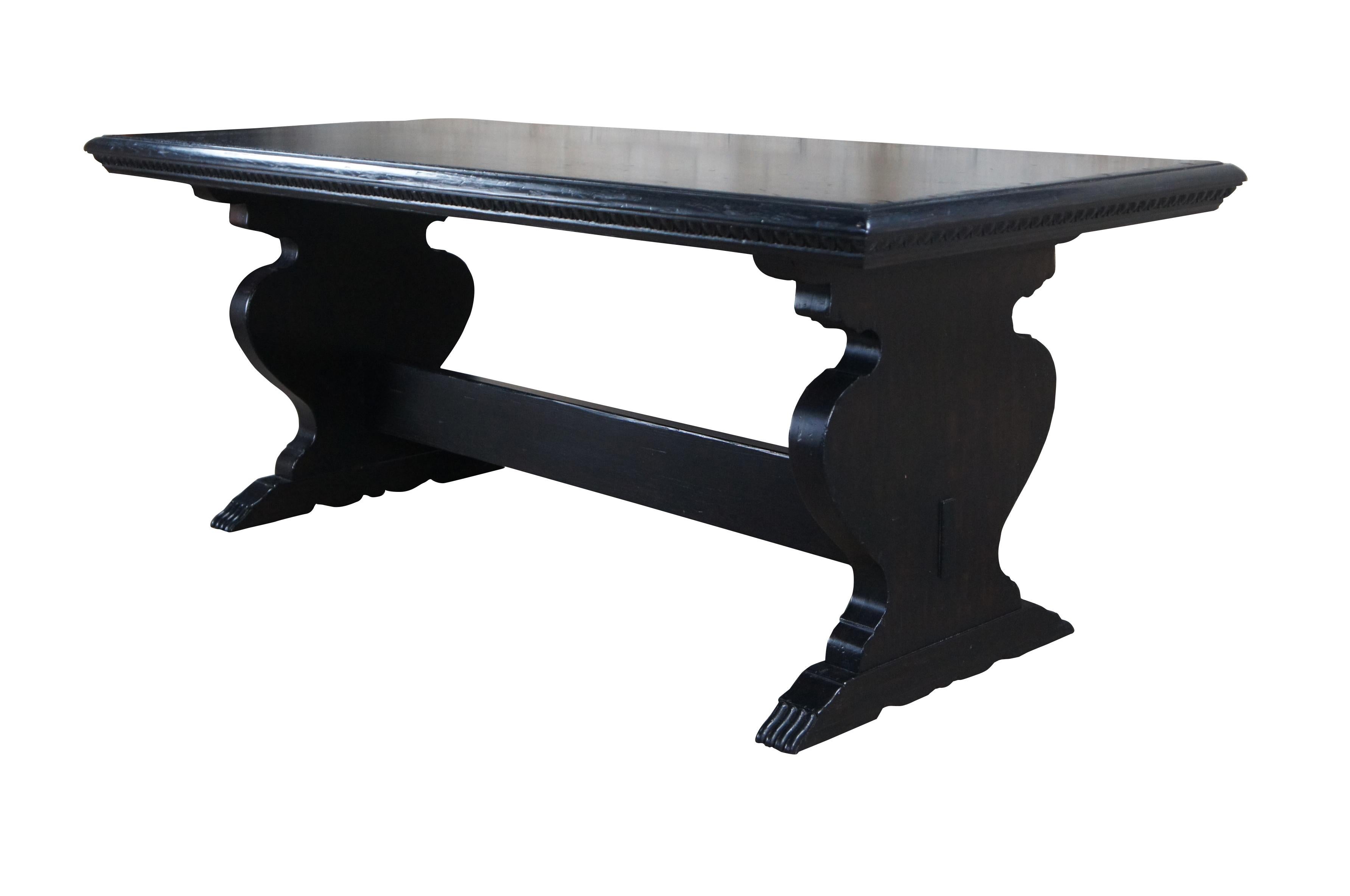 An exquisite library, dining table or desk by Ralph Lauren.  Drawing inspiration from French Provincial & Gothic styling.  Made from solid oak with a rectangular top supported by two vase shaped supports leading to paw feet.  The supports are