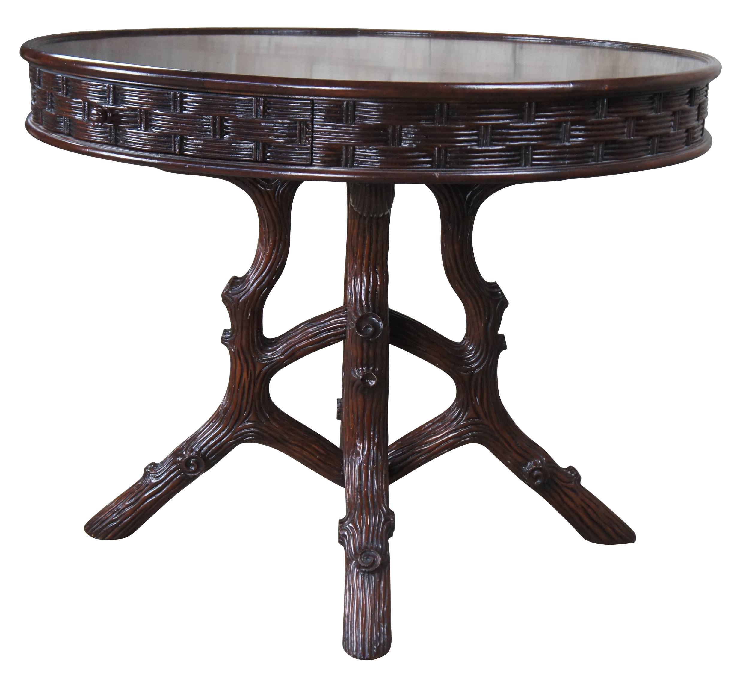 Vintage EJ Victor for Ralph Lauren modern Adirondack center table, circa last quarter 20th century. Made from oak with a warm brown finish. Features a round top with molded basketweave edge and one drawer, over a freeform tree or log molded base. An