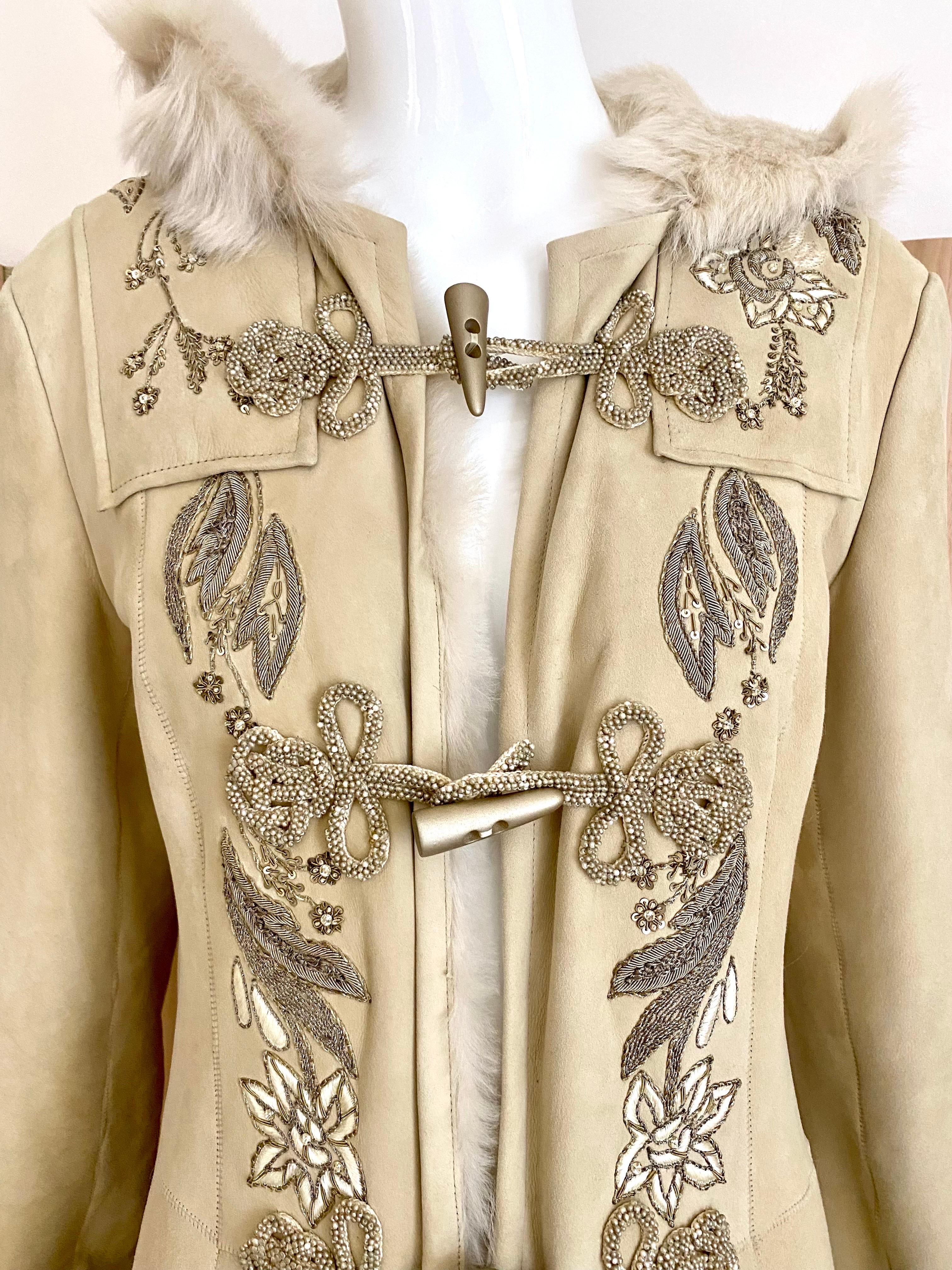Ralph Lauren Purple Label Suede Shearling Coat embroidered with floral beads in gold, silver, and white. Toggle buttons. Pockets.
price tag $12.000
Marked Size: 8
Measurement: Bust: 36” / Waist: 32” / Hip: 36”/ Coat Length: 54” / Sleeve : 27”