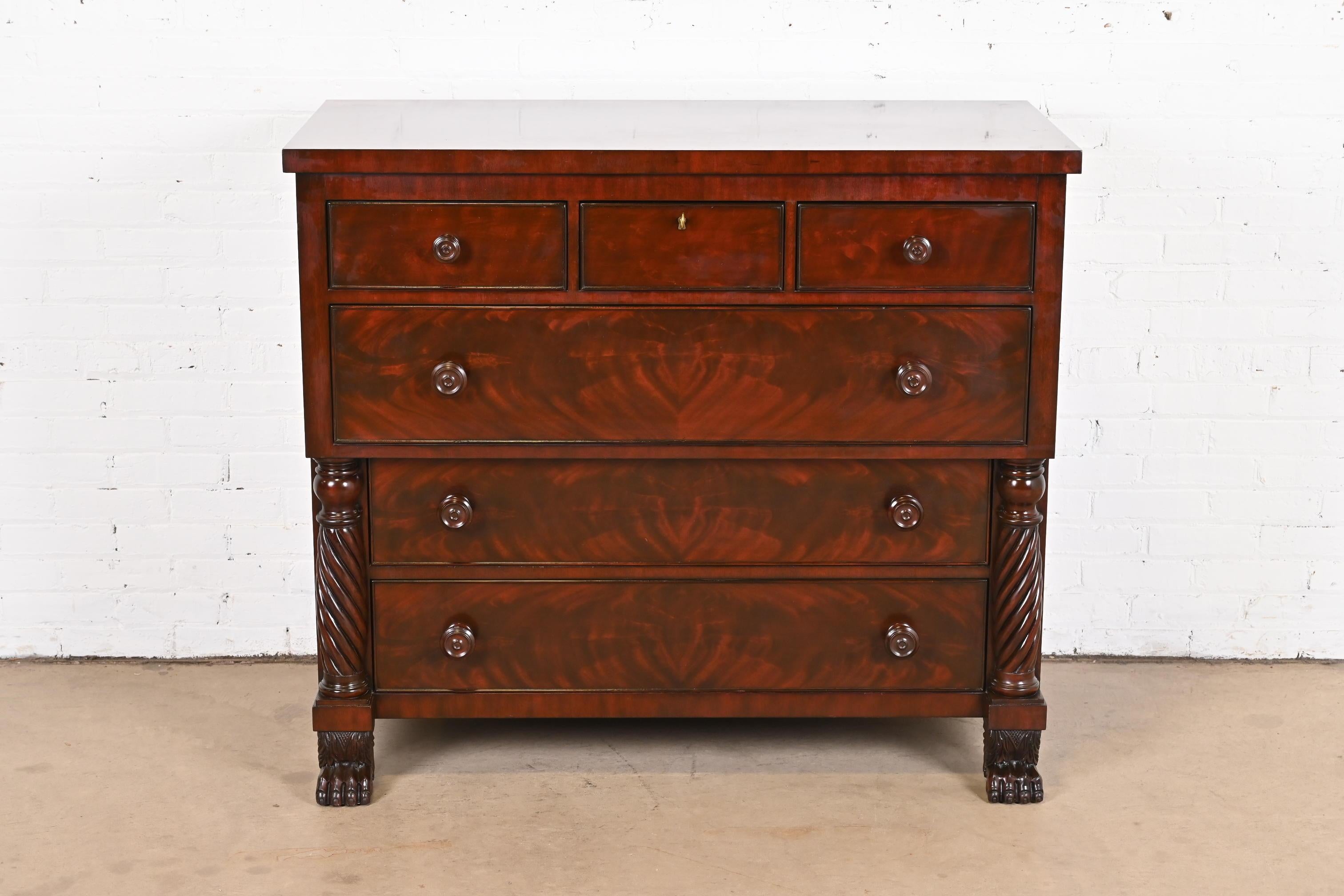 A gorgeous American Empire six-drawer highboy dresser or chest of drawers

By Ralph Lauren

USA, Late 20th century

Stunning book-matched flame mahogany, with carved columns and paw feet.

Measures: 48